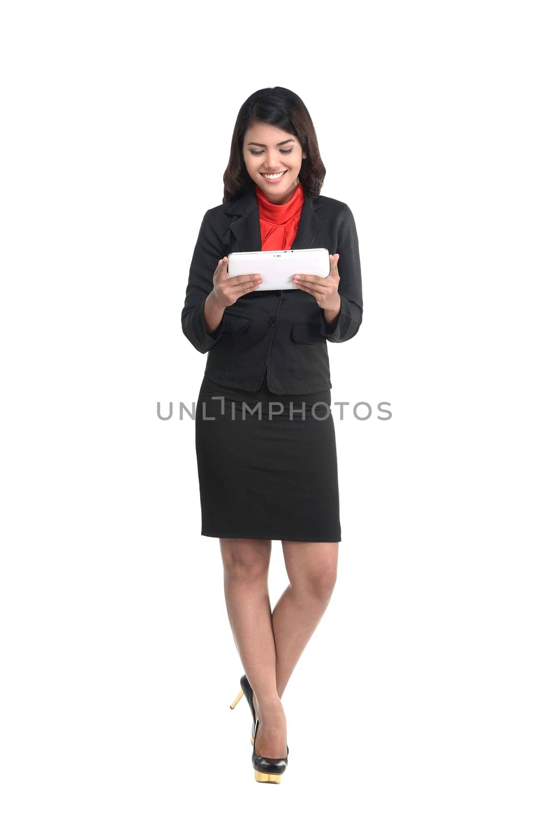 Business woman holding computer tablet isolated over white background