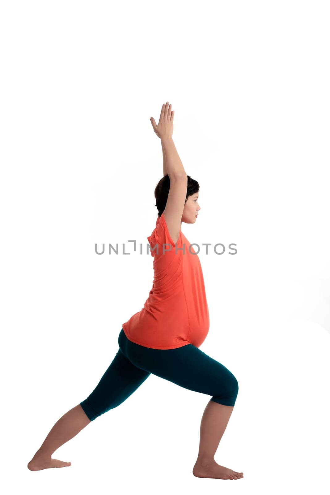 Asian pregnant woman doing yoga over isolated white background