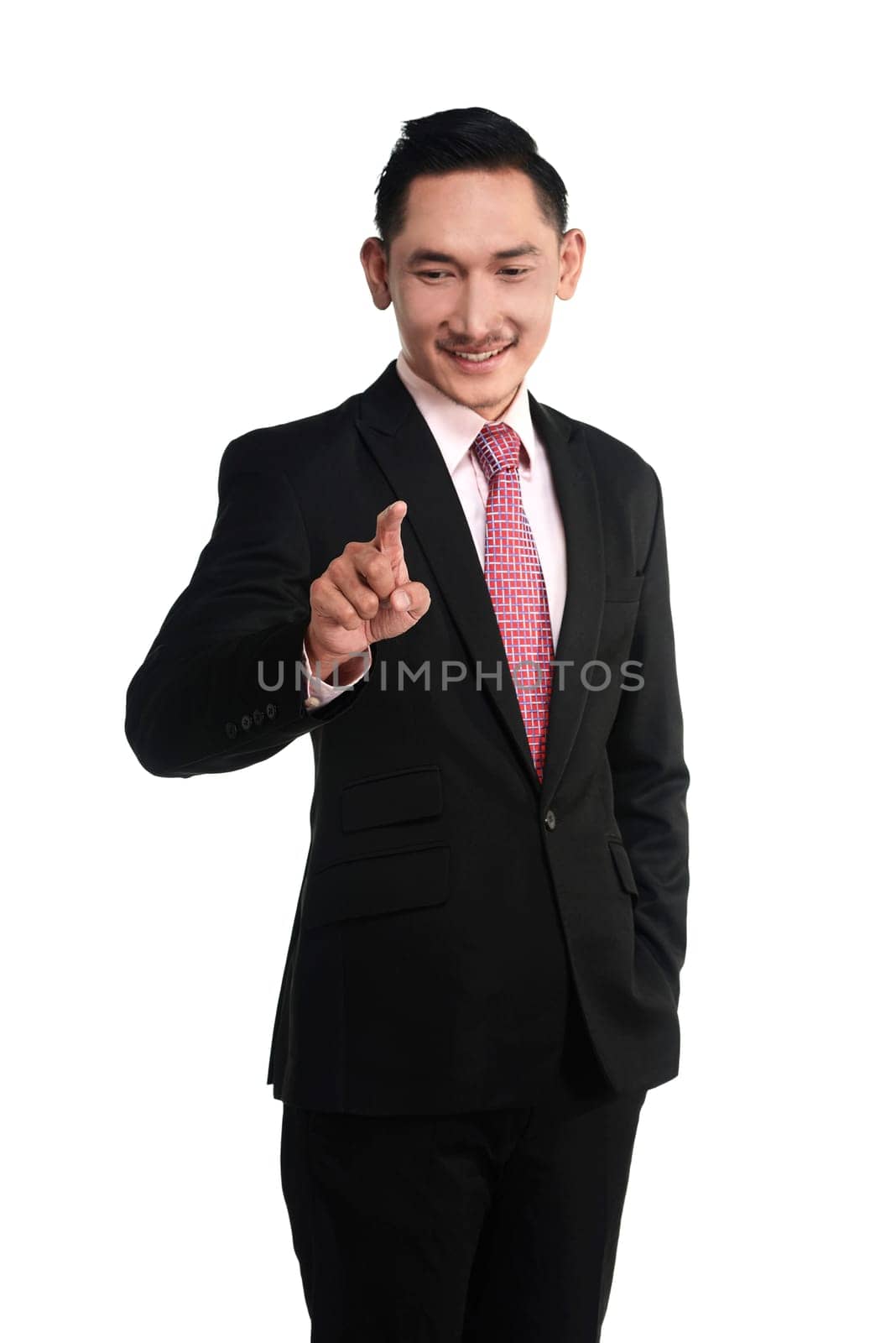 Asian business man pointing something isolated over white background