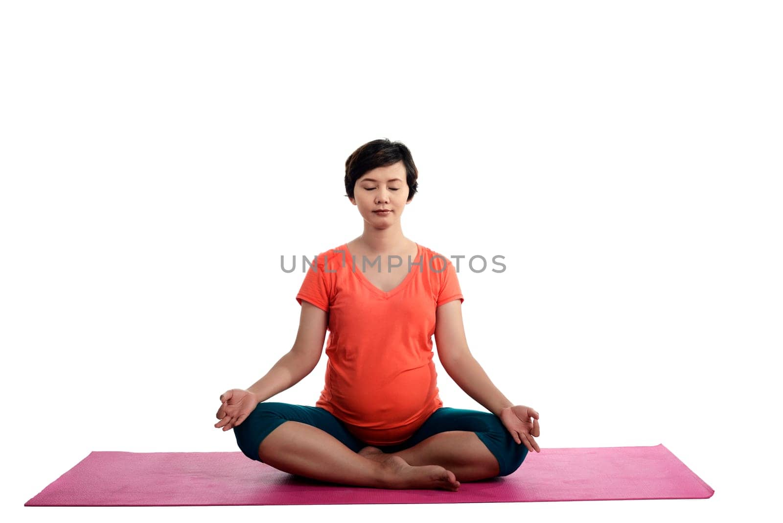 Asian pregnant woman doing yoga over isolated white background