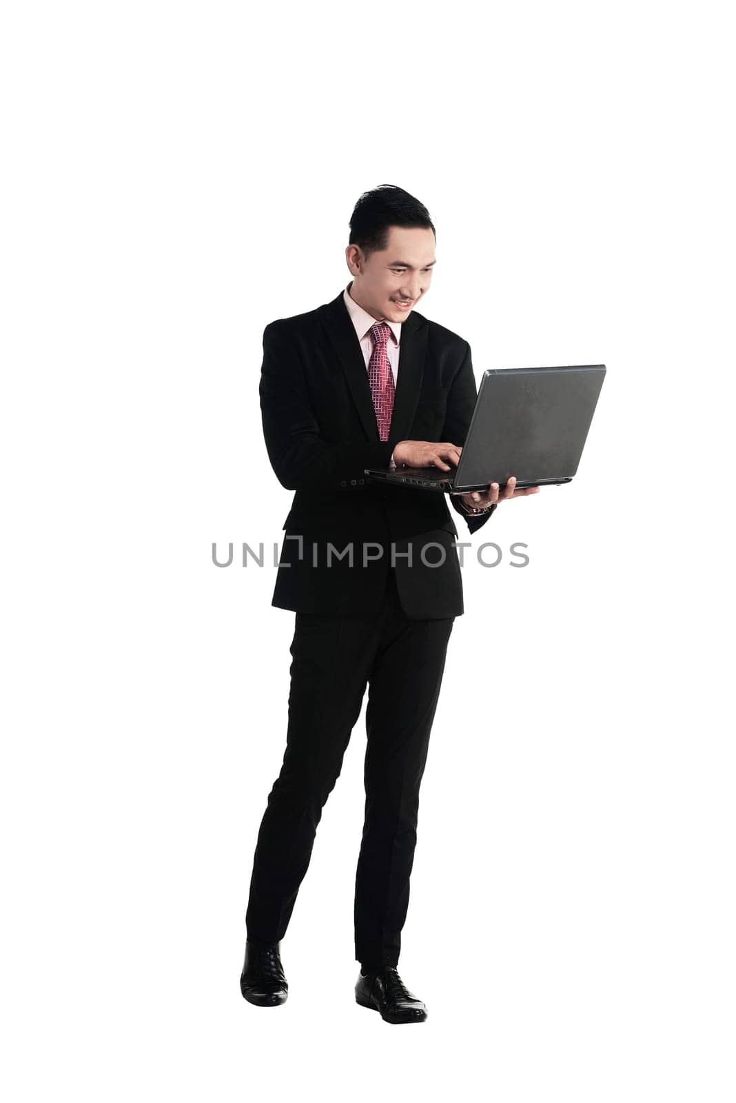 Asian business man holding laptop isolated over white background