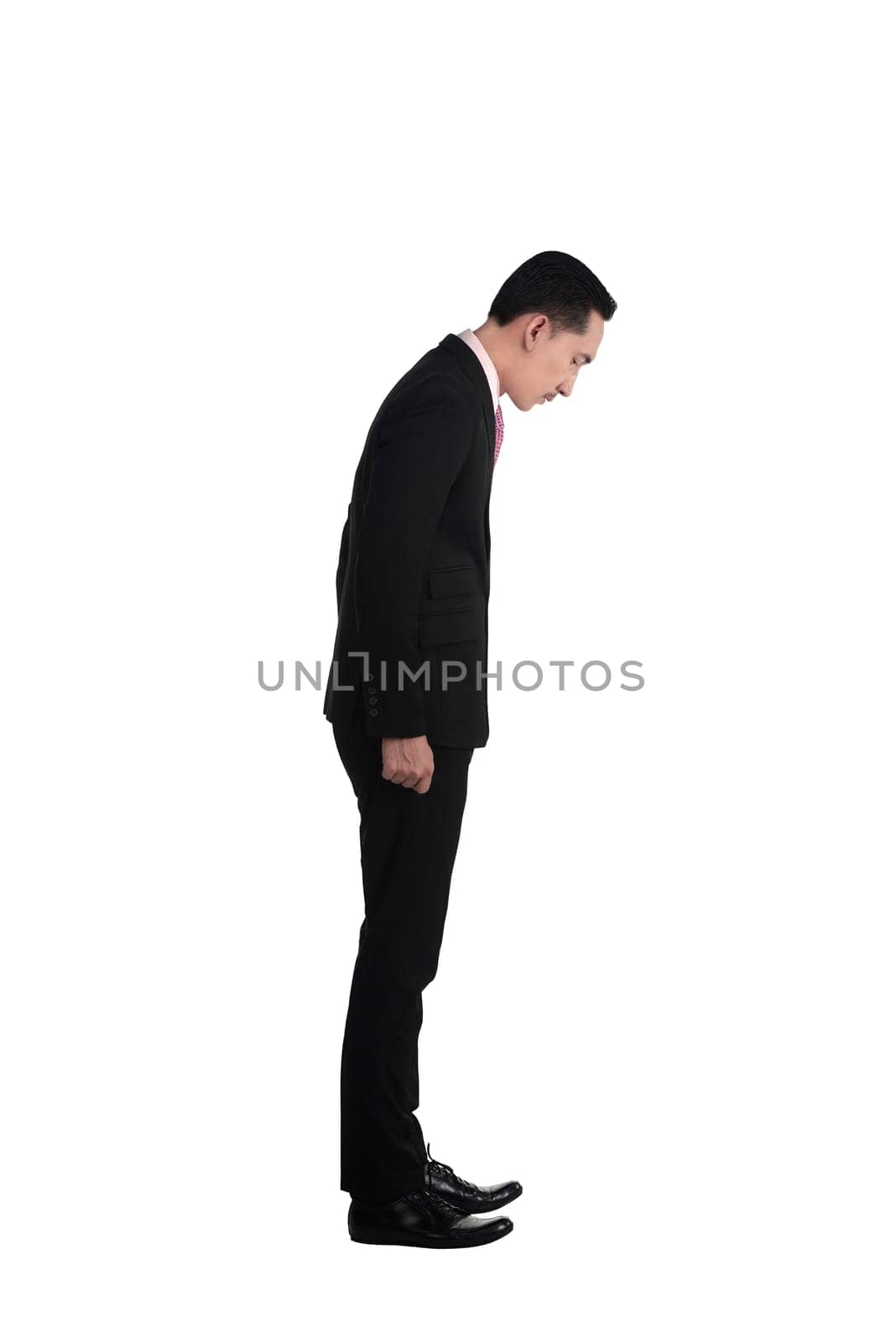 Asian business man looking down isolated over white background