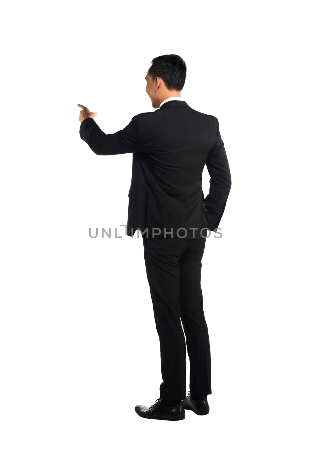 Asian business man pointing something isolated over white background