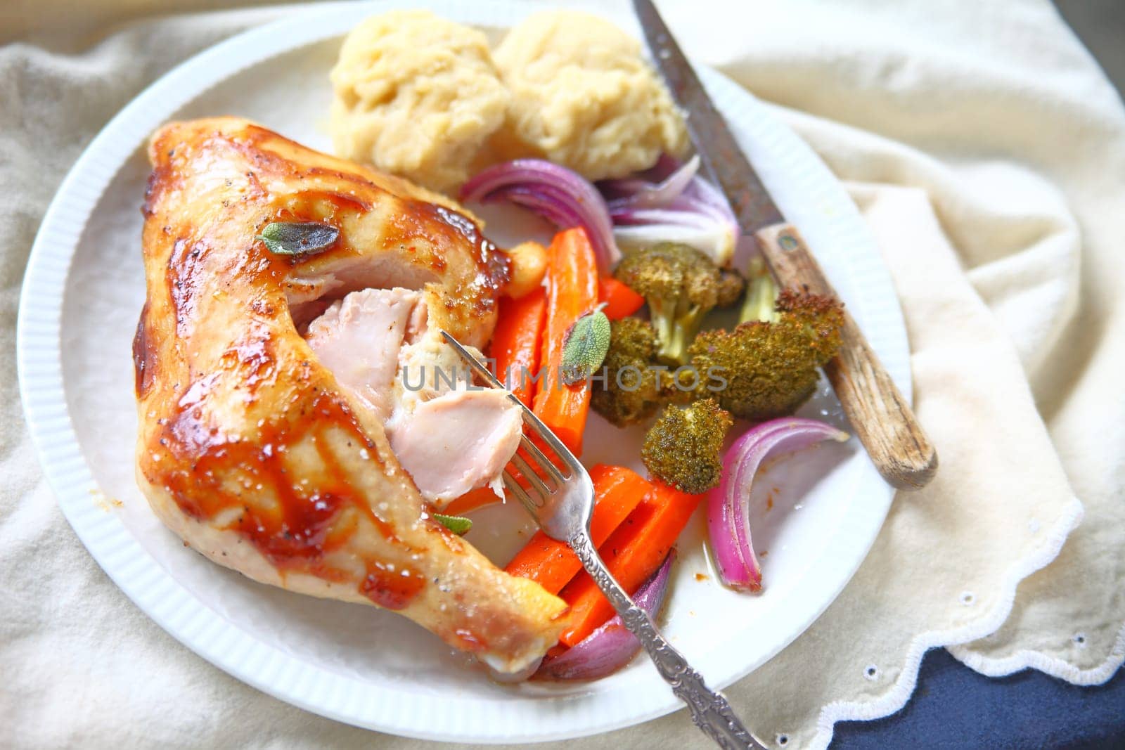 Roast chicken with hoisin sauce, carrots, onions, broccoli and drop biscuits
