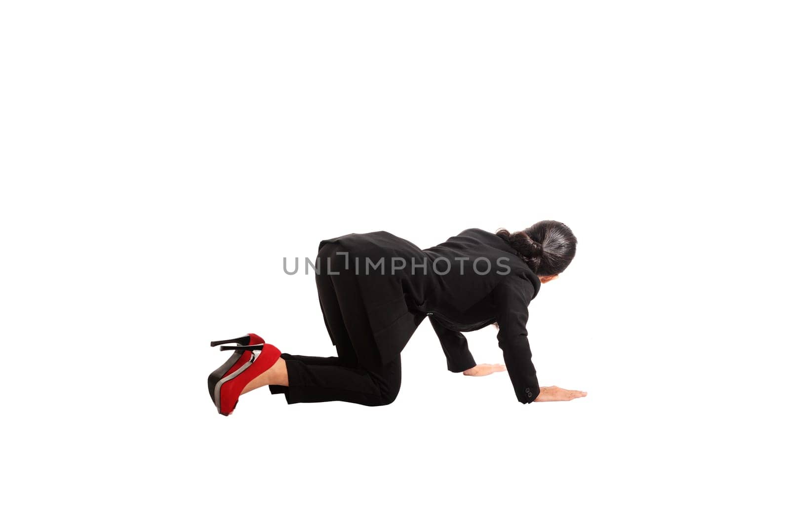 Asian business woman crawling isolated over white background