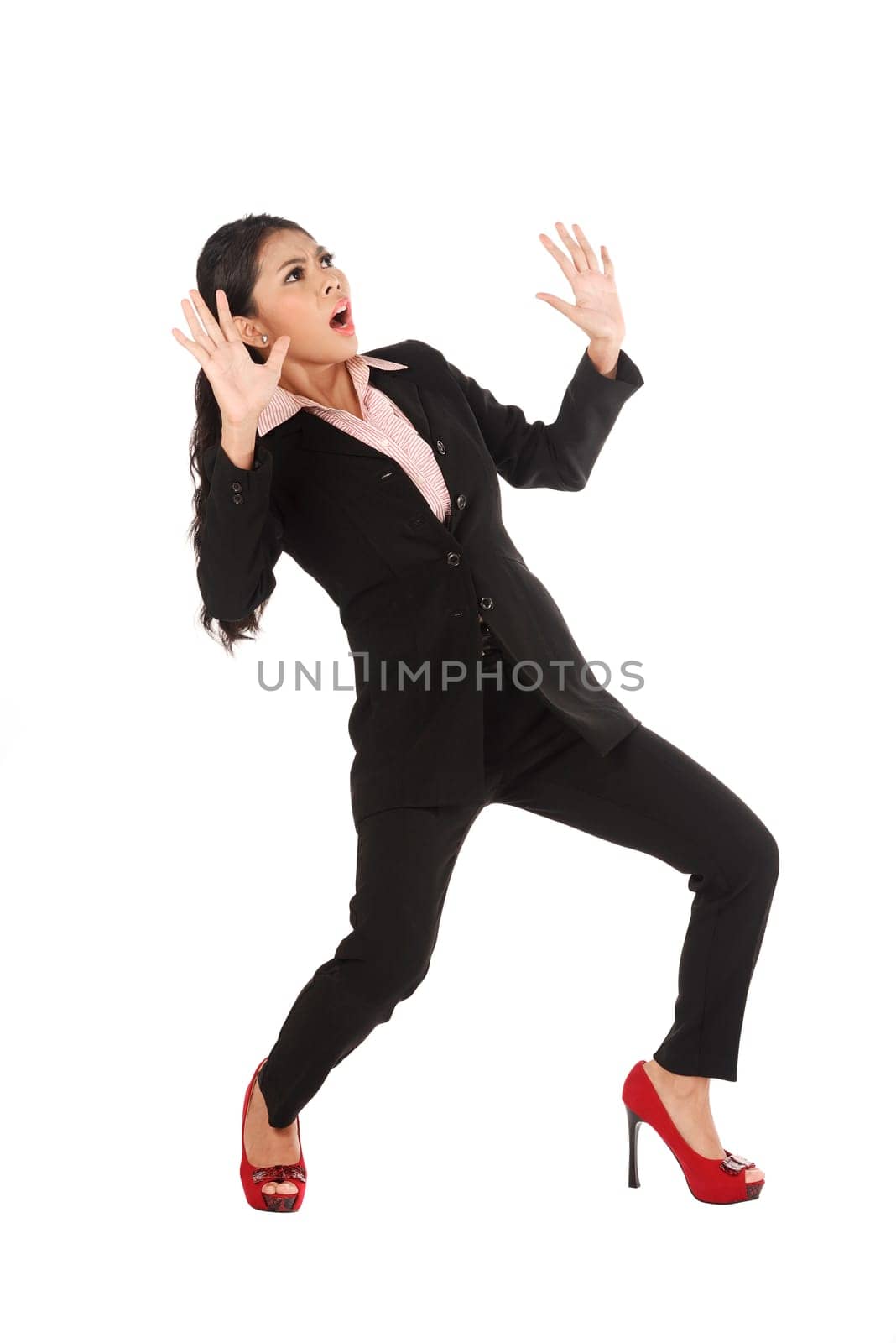 Asian business woman shock isolated over white background