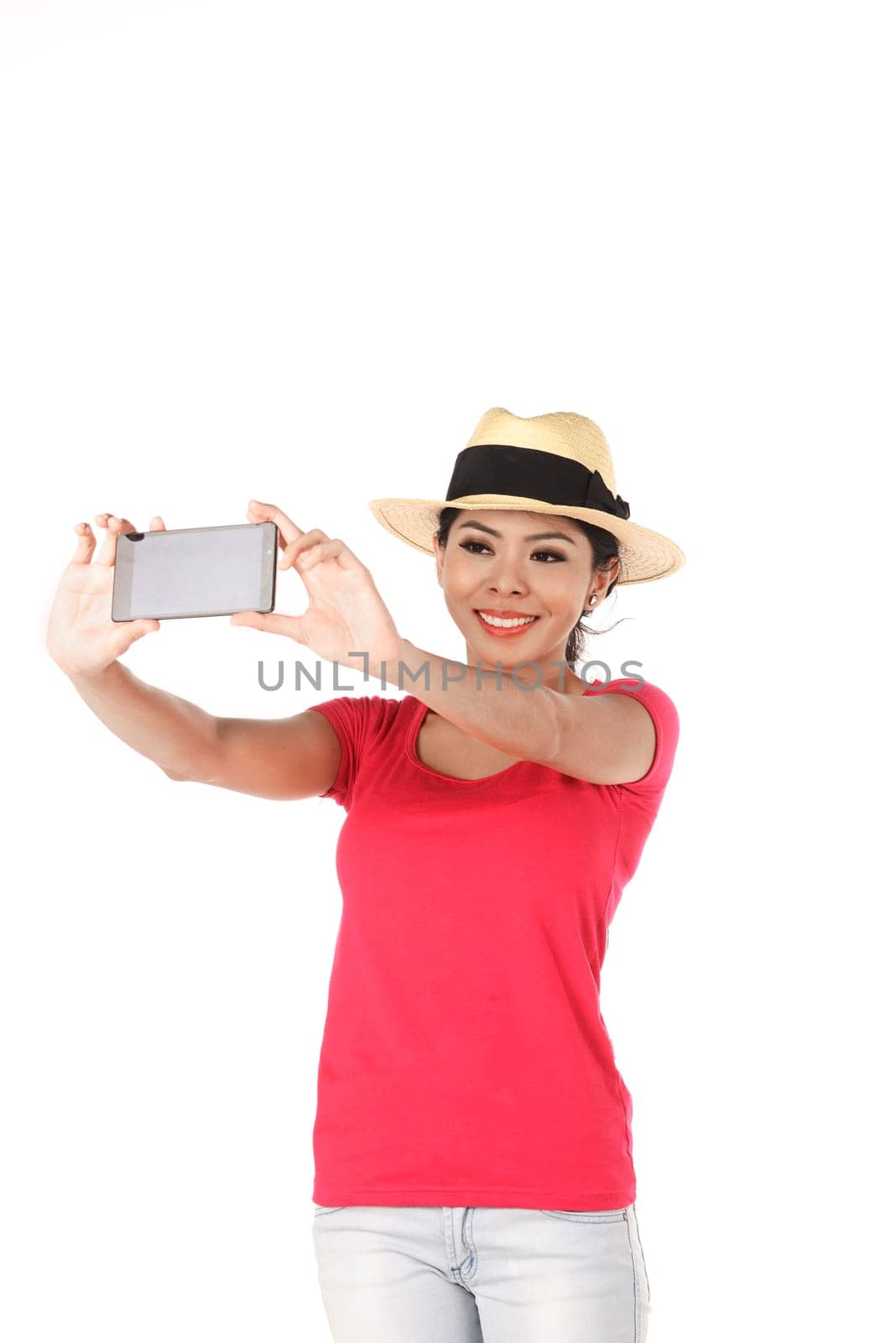 Asian woman doing selfie isolated over white background