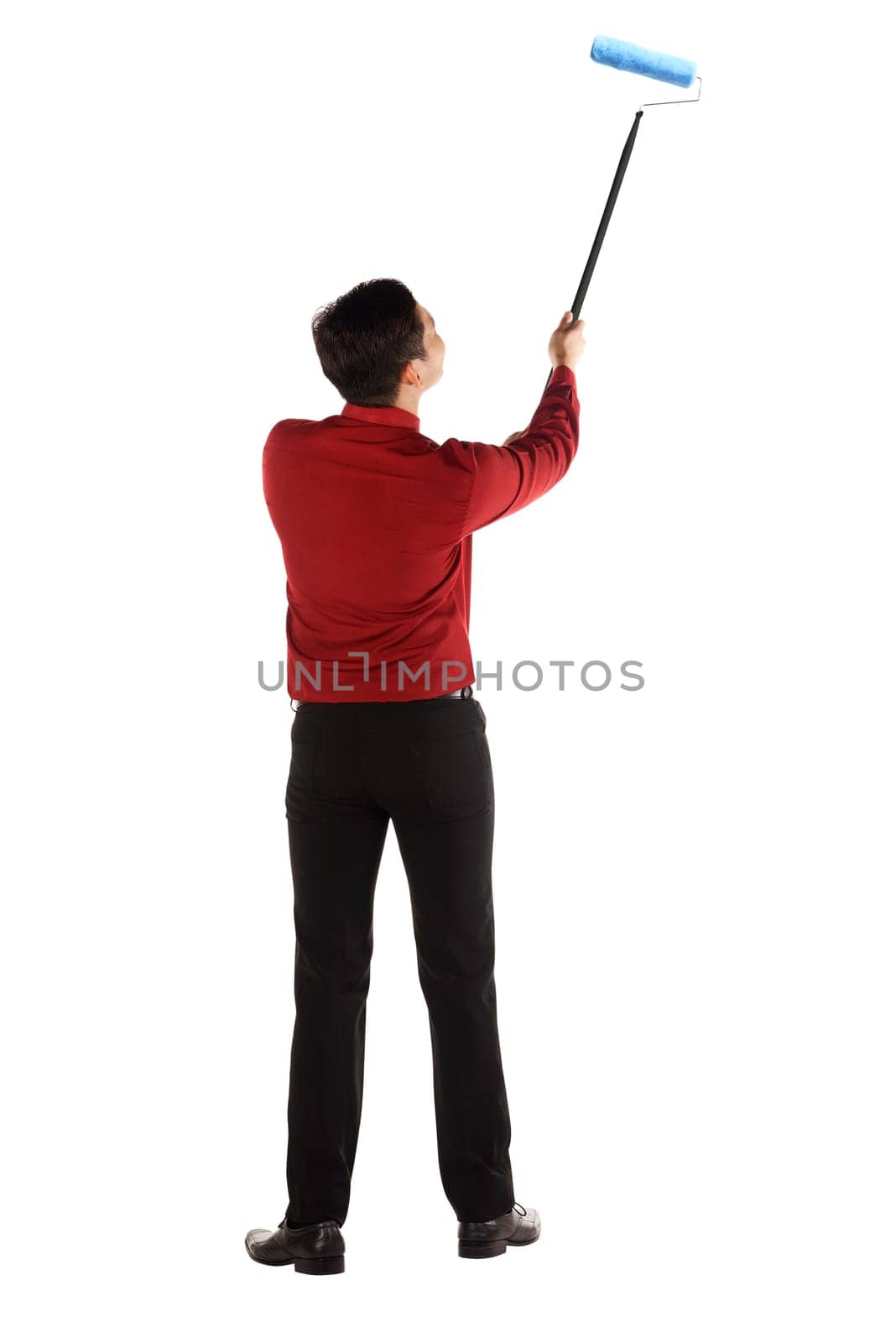 Man painting something with roller brush isolated over white background