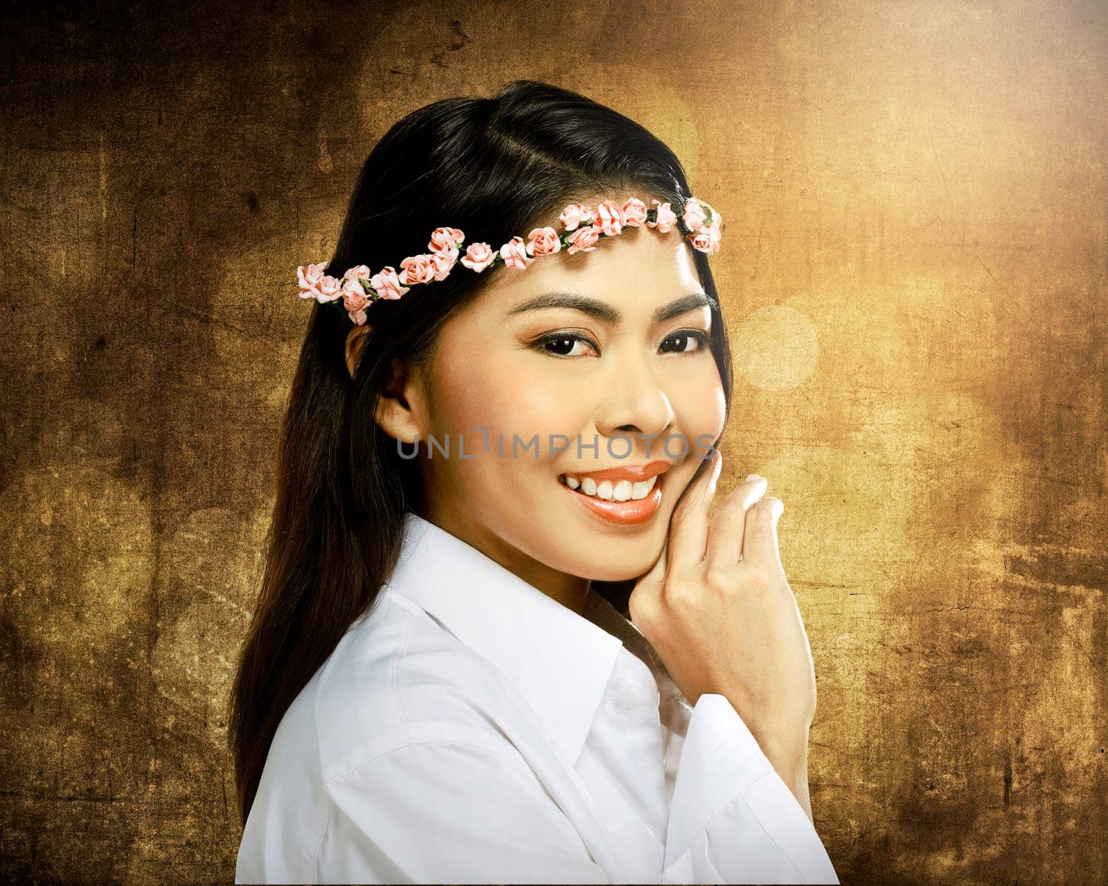 Pretty asian woman wearing flower headband over blur background