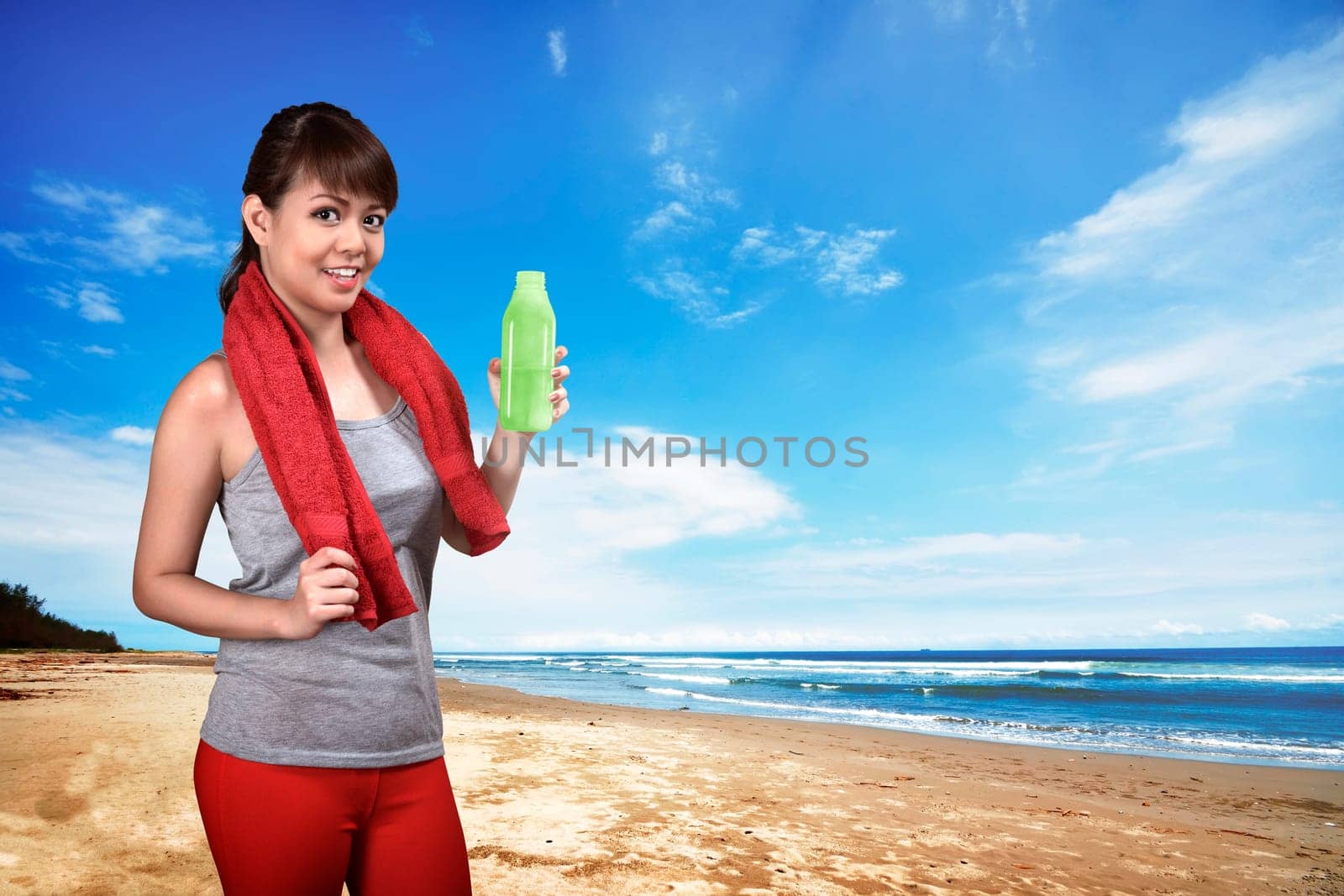 Asian woman doing exercise on the beach