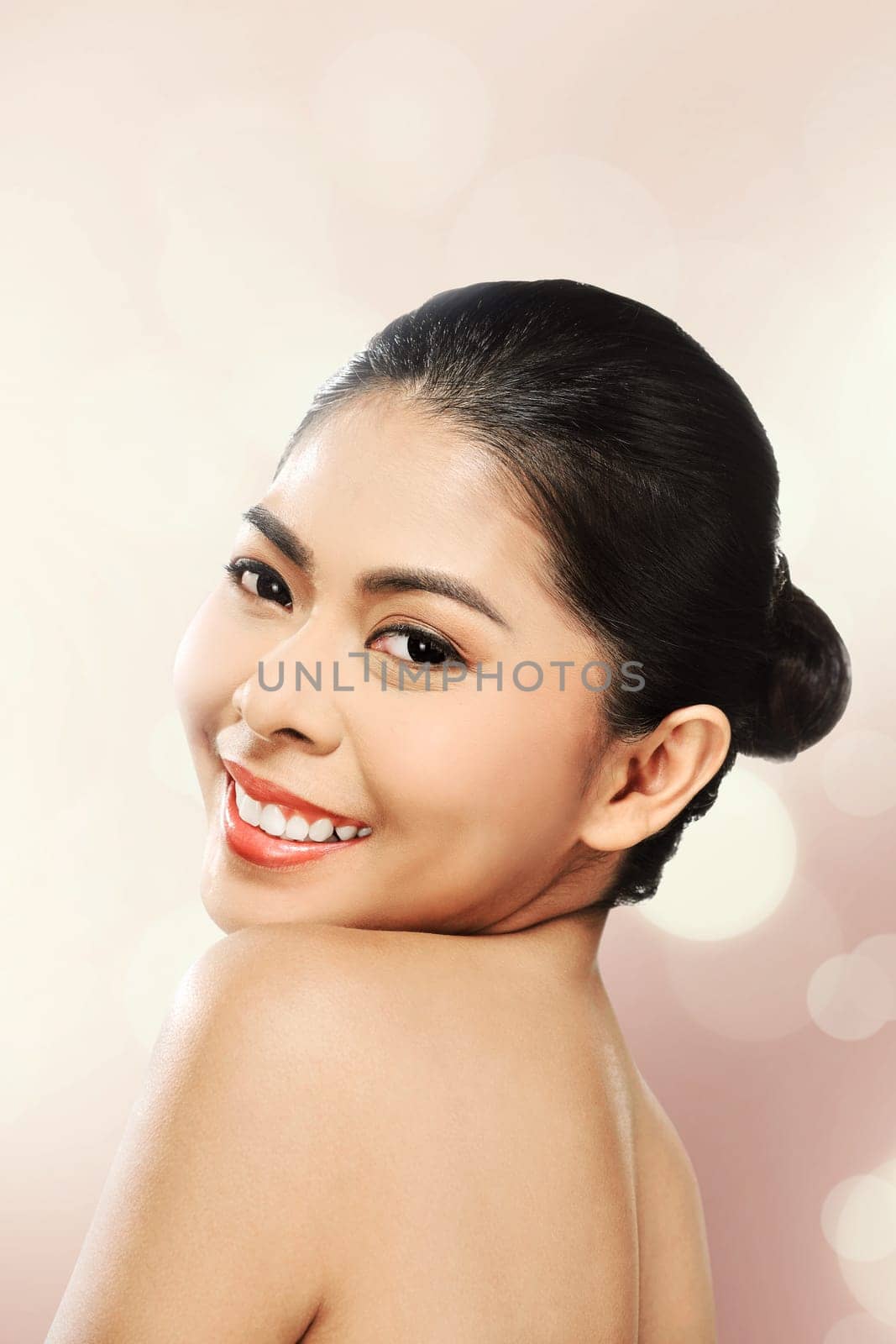 Beautiful asian woman in studio with abstract blur background