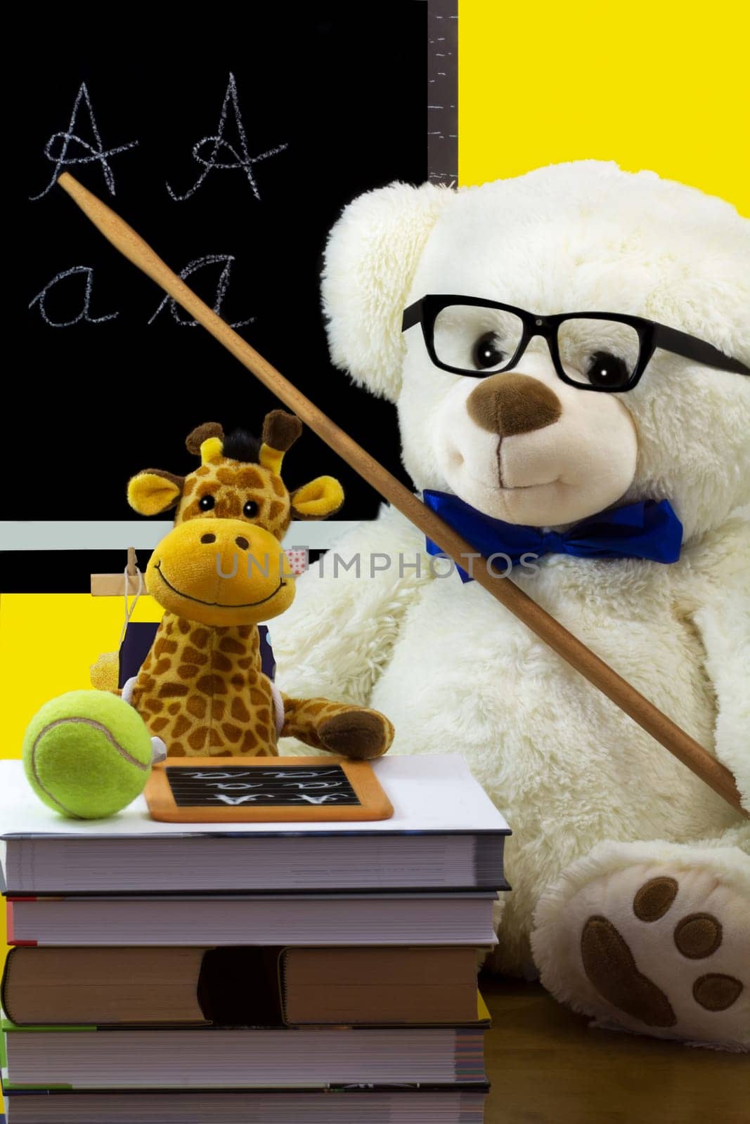 The teacher shows the student the letters on the board.