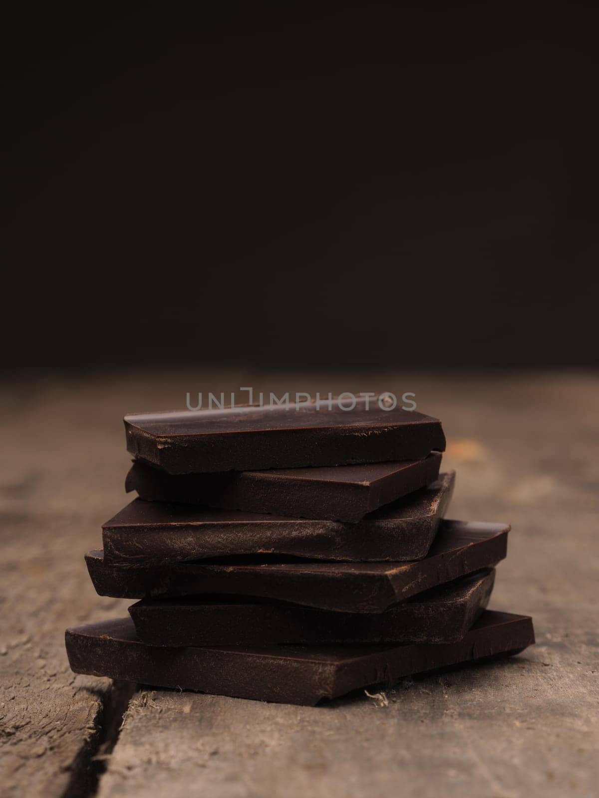 Pile of chocolate on a rustic wooden table