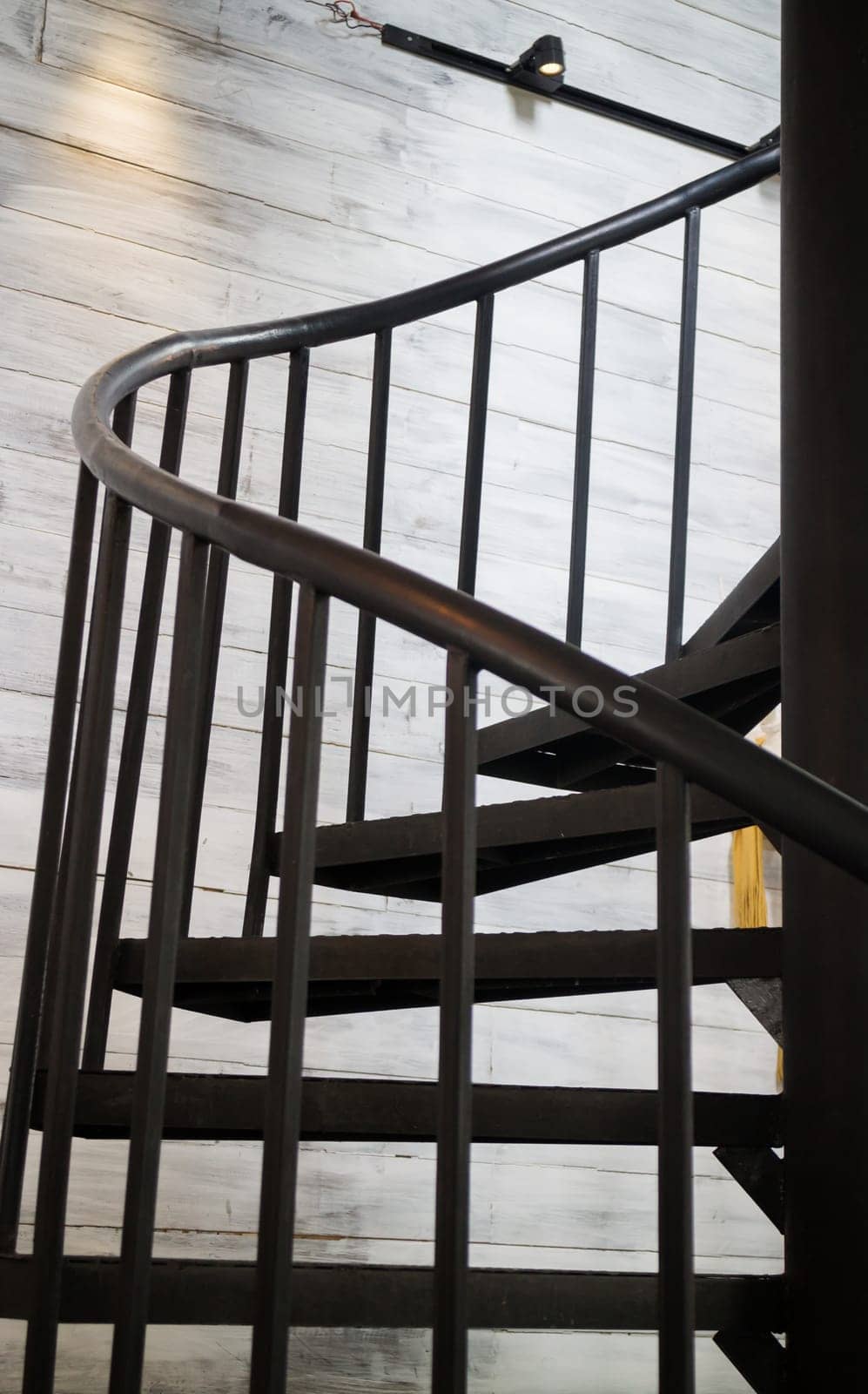 Dark iron metal spiral staircase, stock photo