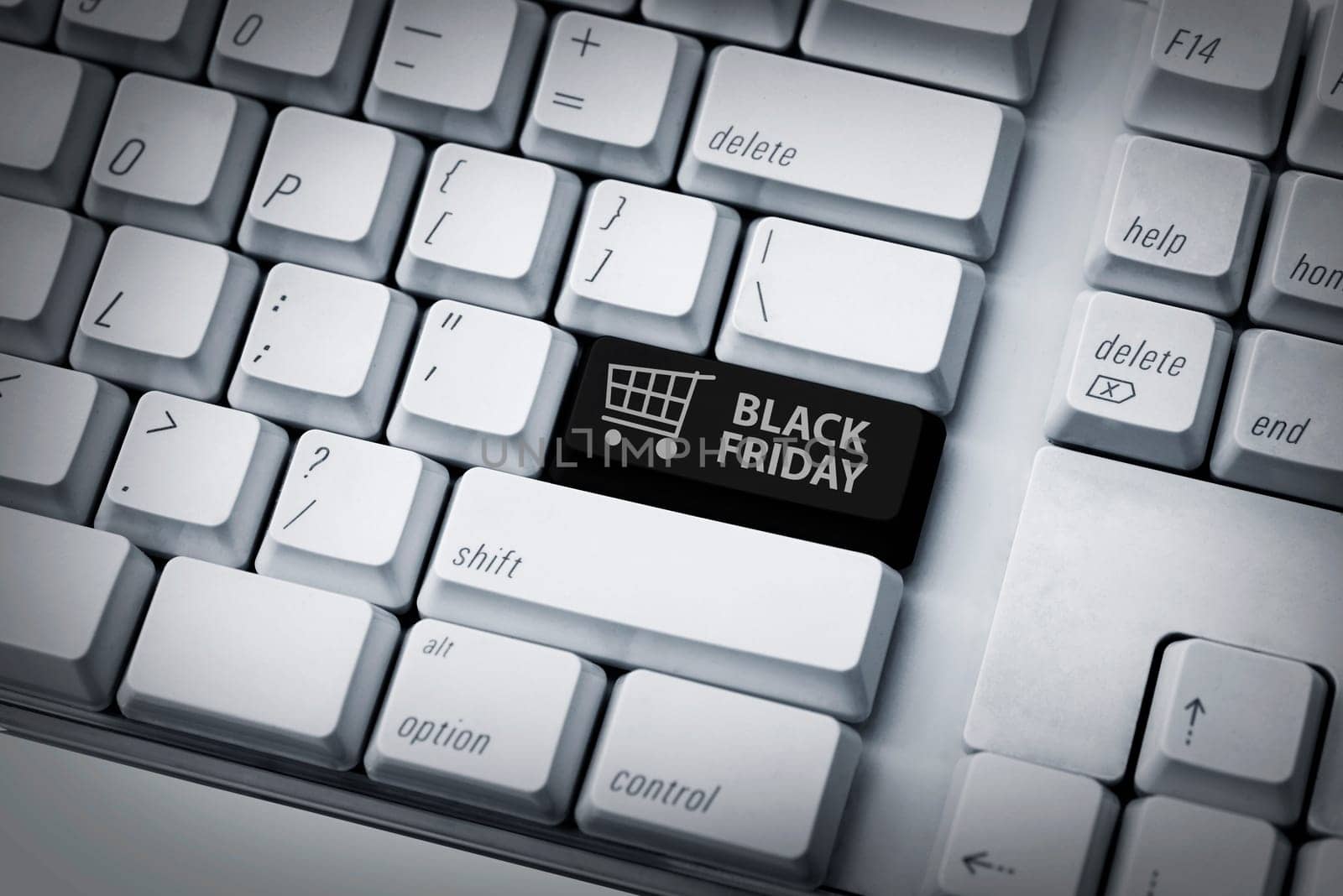 Black friday text and shopping cart on keyboard. Black friday concept
