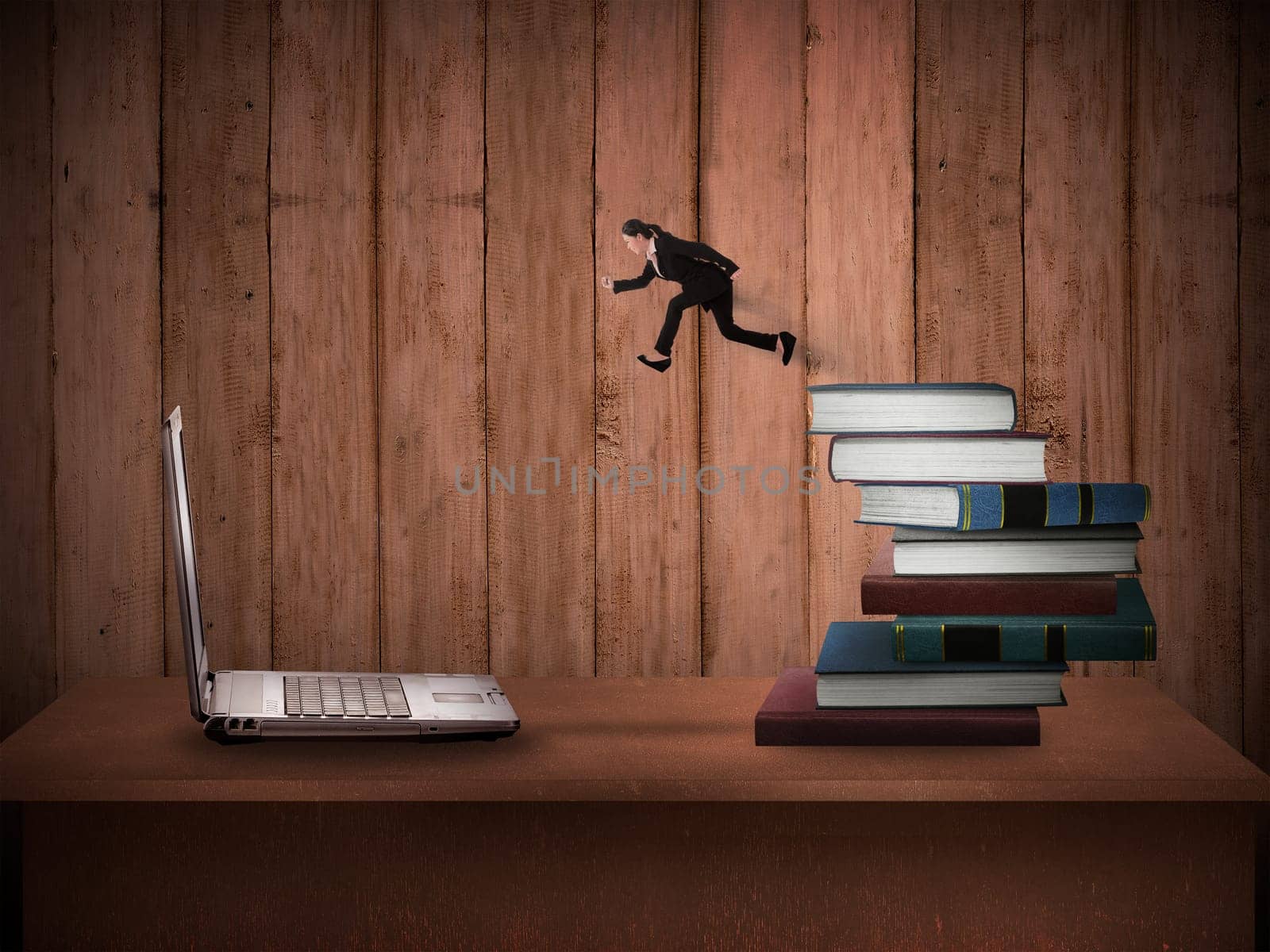 Concept of technology migration with business person jumping from book to laptop