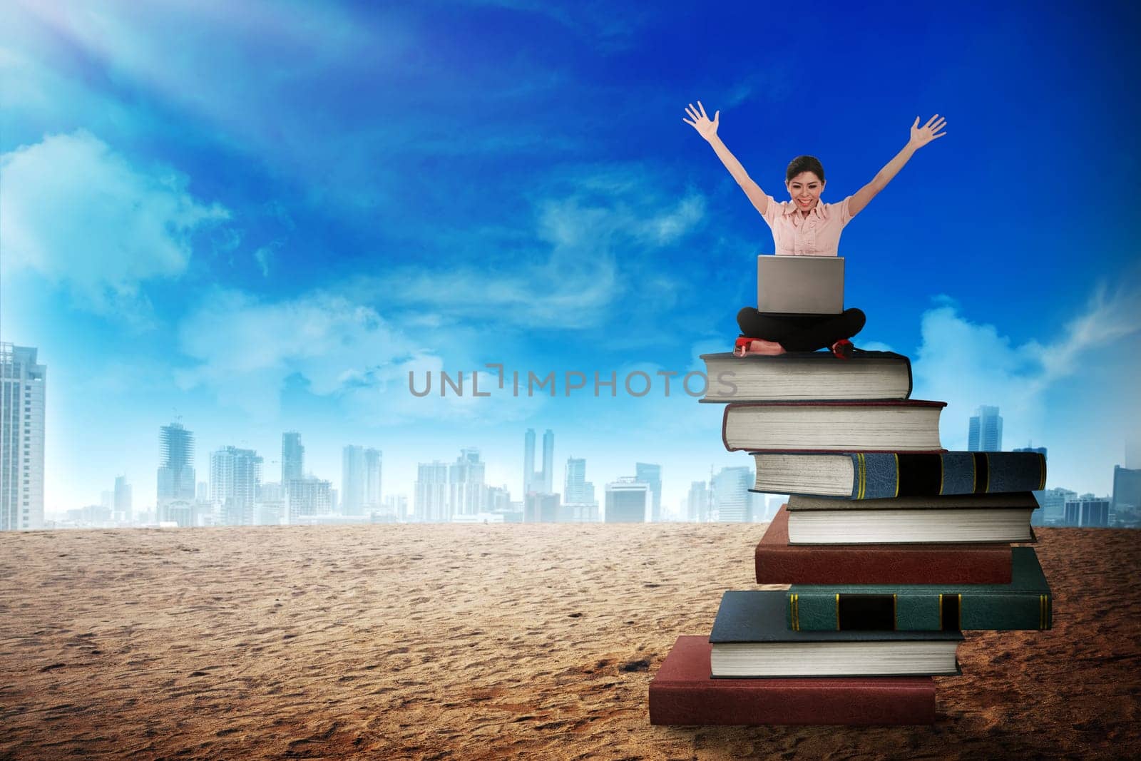 Business person working with laptop on the top of books. Career and education concept