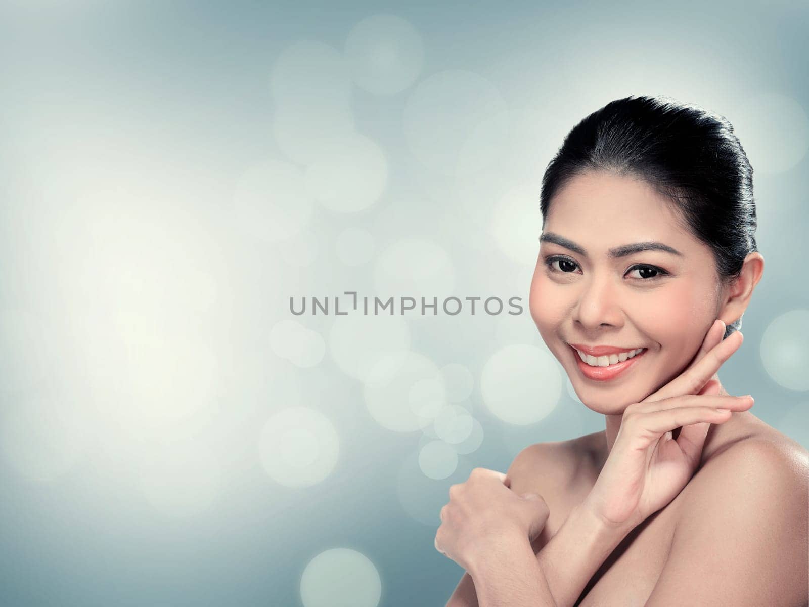 Beautiful asian woman in studio with abstract blur background