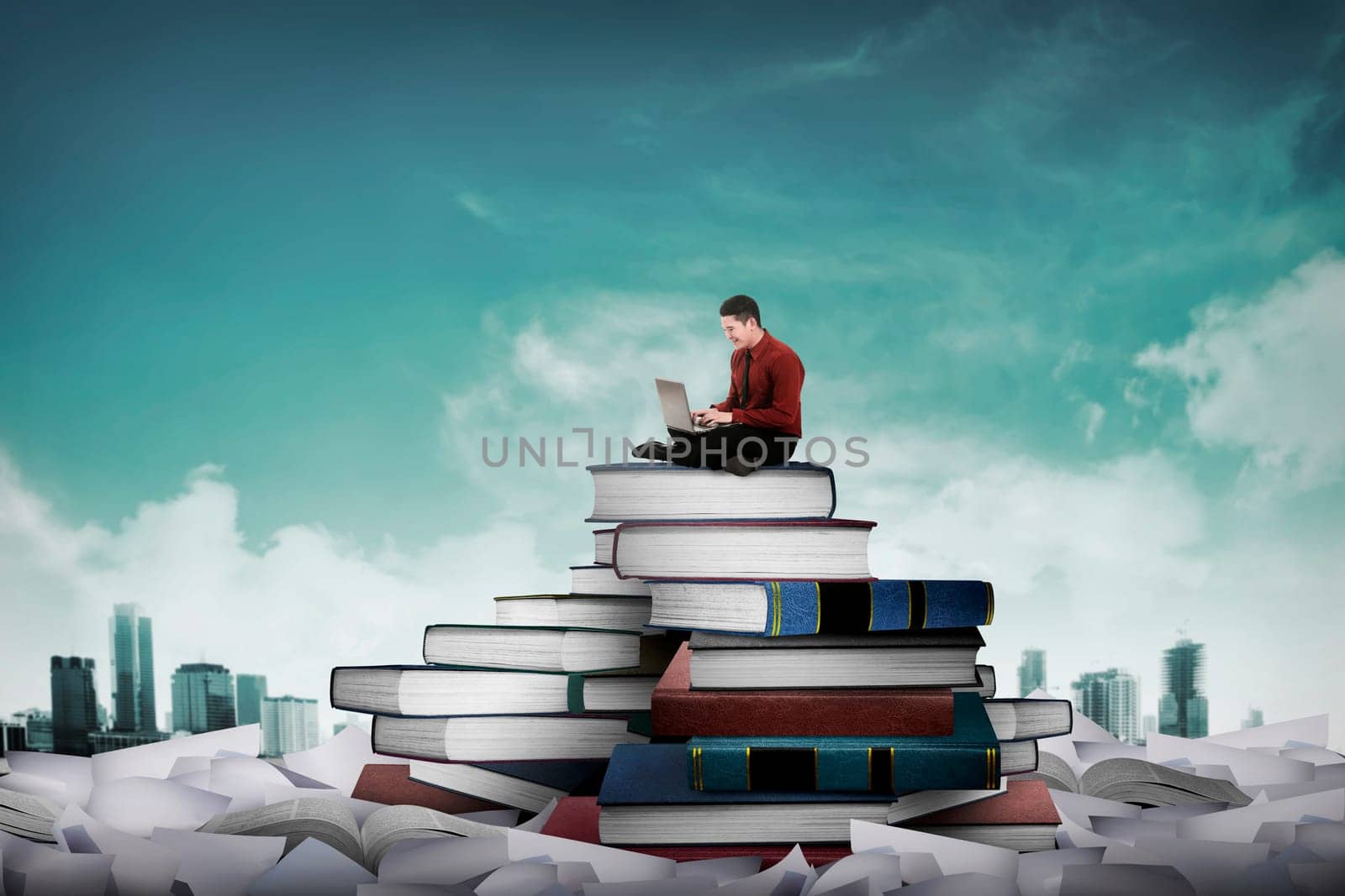 Asian business person working with laptop sit on top of book. Idea and knowledge concept