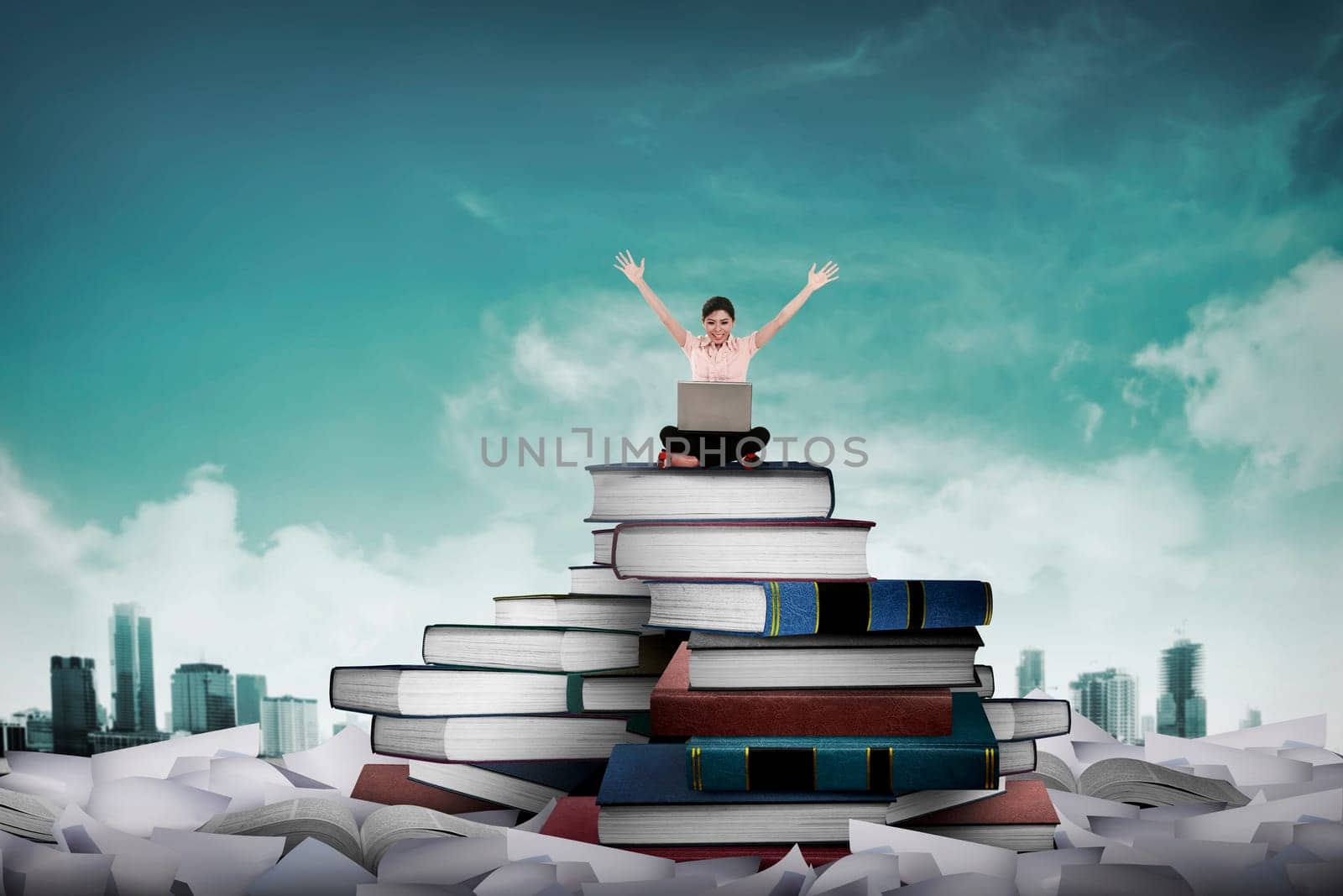 Asian business person working with laptop sit on top of book. Idea and knowledge concept
