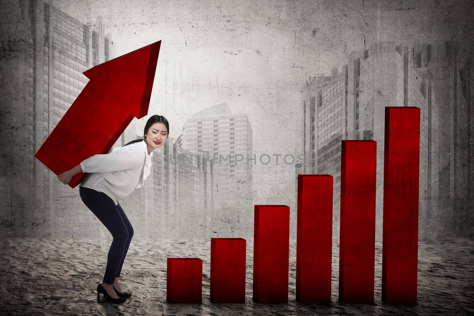 Asian business woman lifting heavy arrow. Business challenge concept