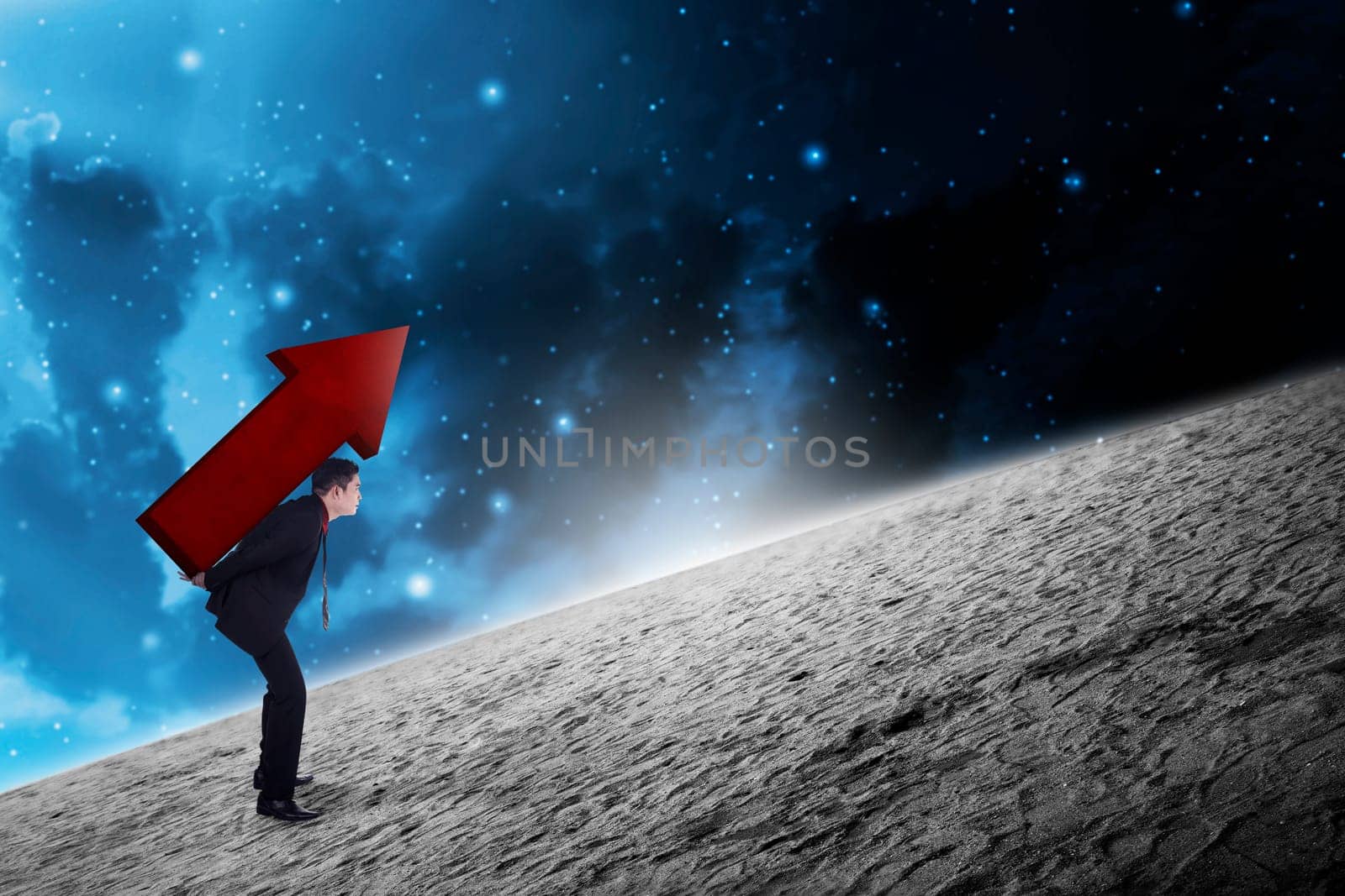 Asian business man carry big red arrow on his back. Business difficulty concept