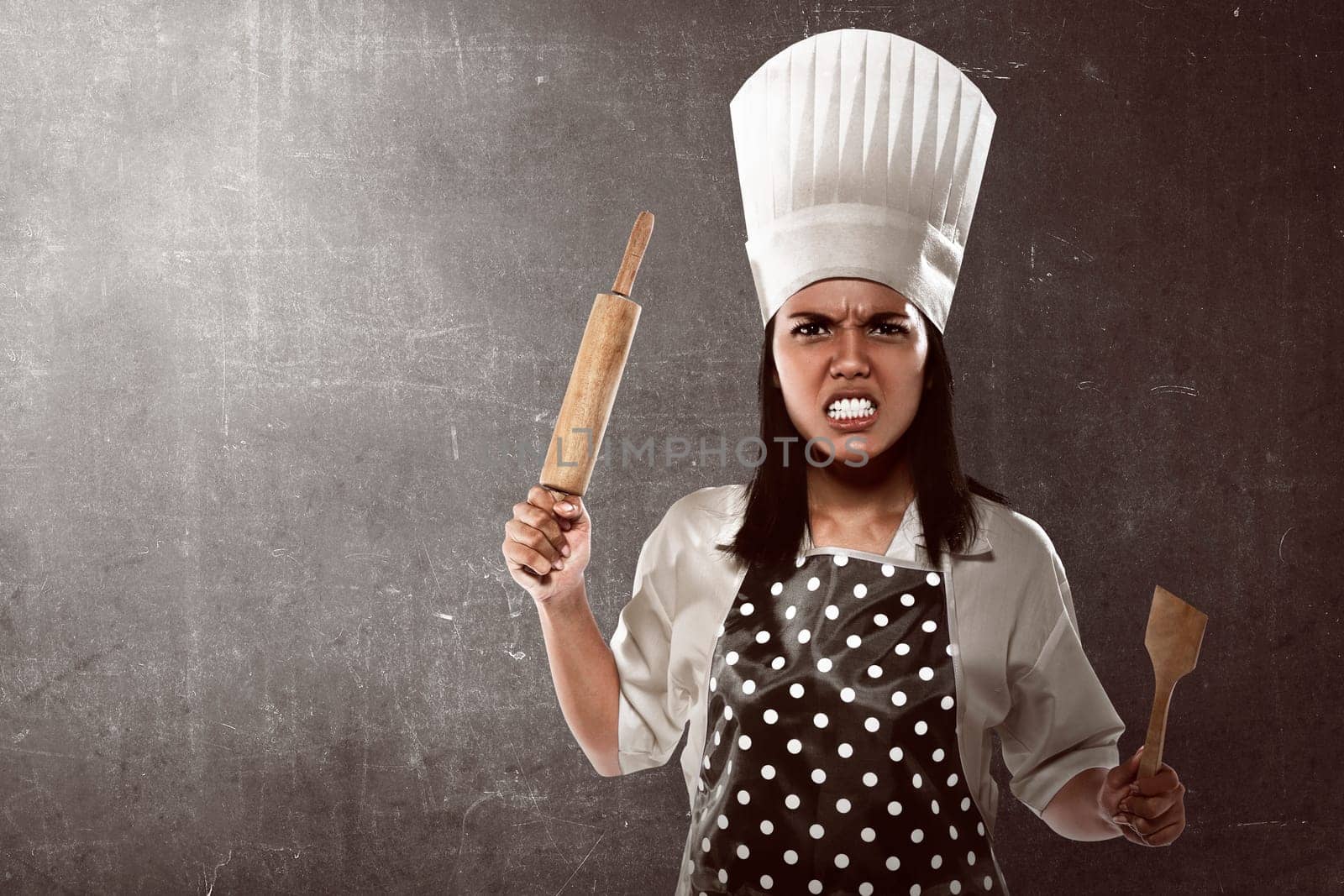 Angry asian woman chef over over abstract background