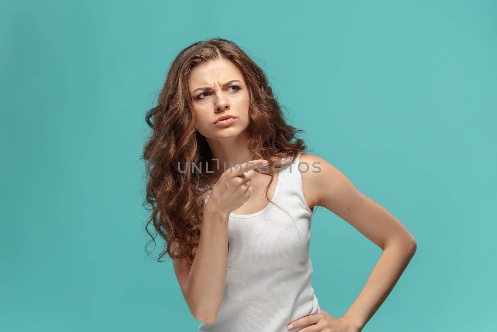 The young woman's portrait with sad emotions at studio