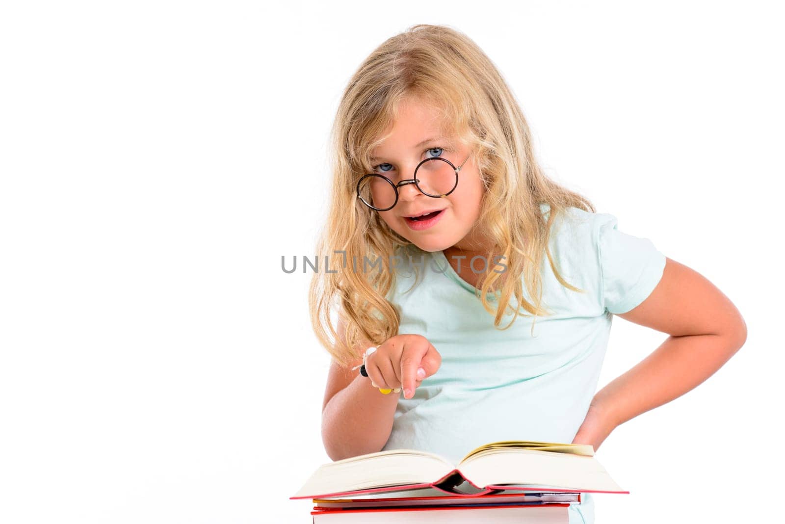 sweet funny girl with pile of books and round glasses