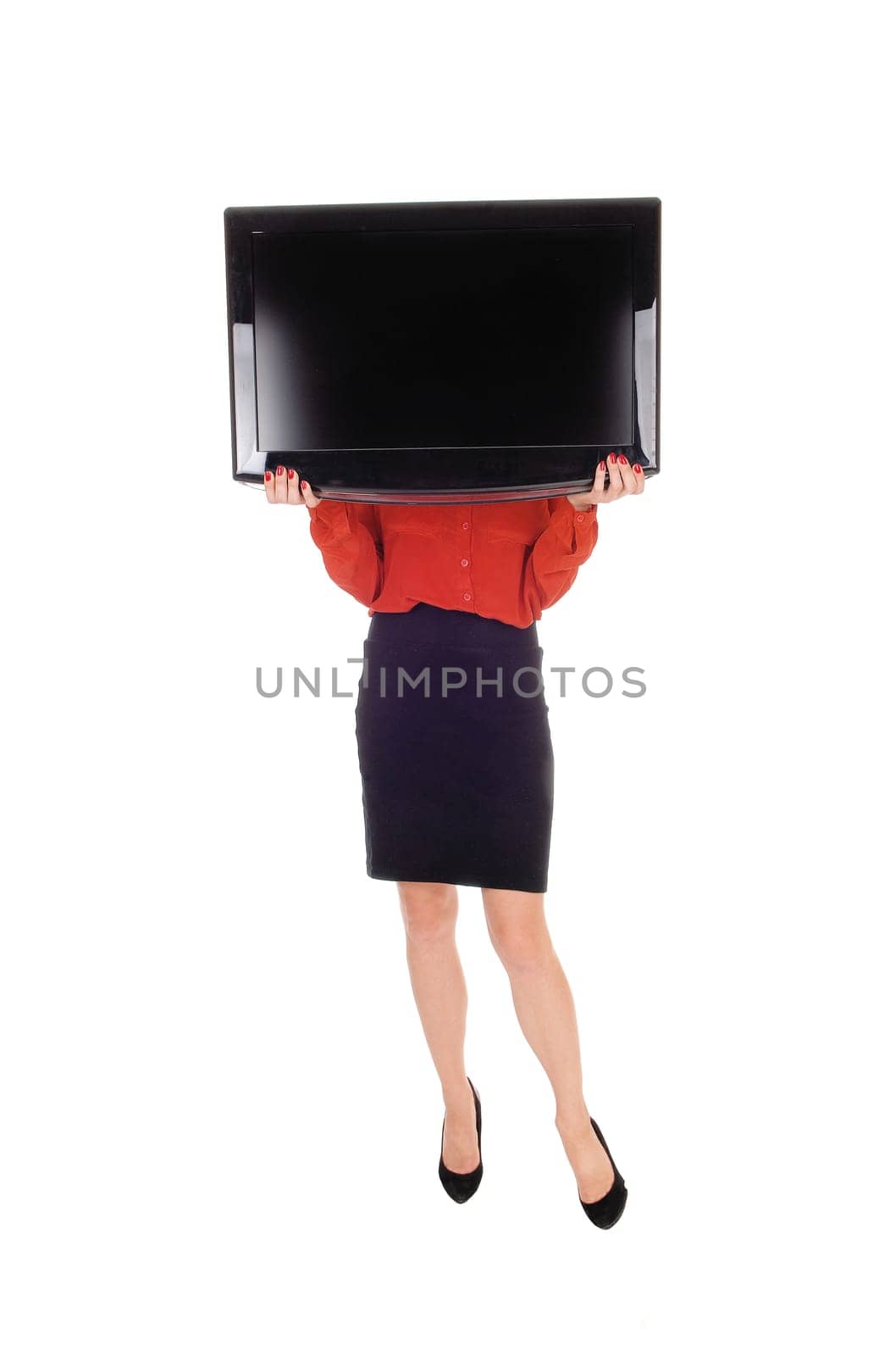 A young woman standing isolated for white background holding a.flat TV in front of her face, standing in a black skirt and red blouse..