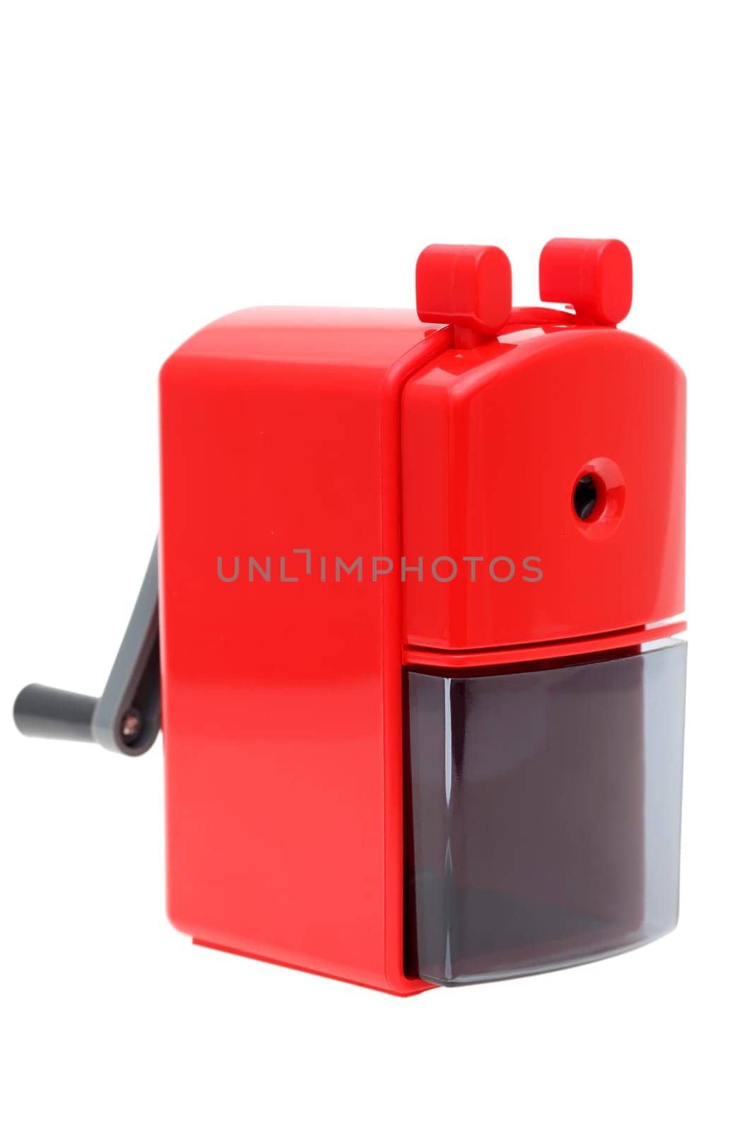 Red plastic pencil sharpener on white background