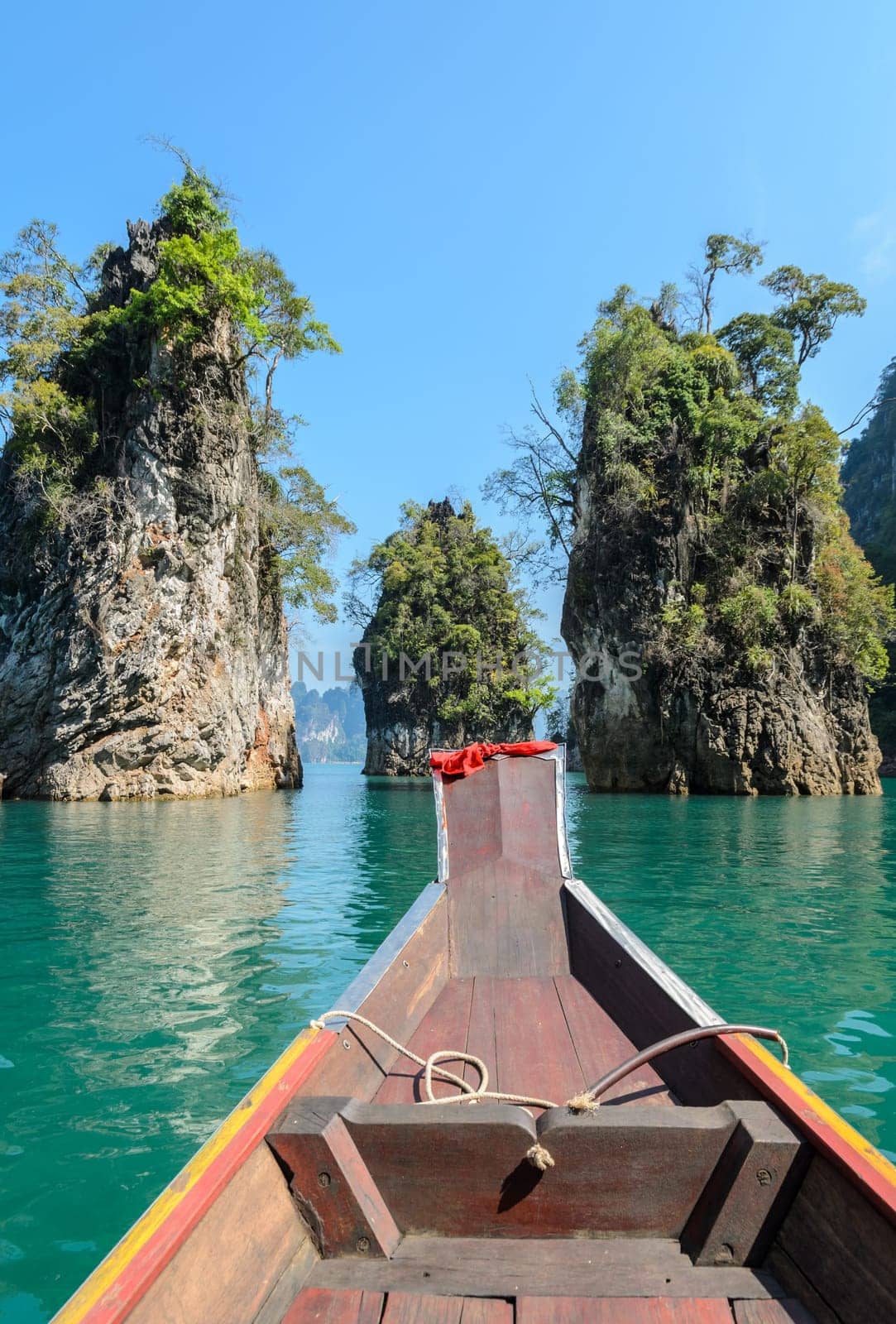Beautiful limestone mountain ranges and natural attractions with long-tailed boat at Khao Sok National Park in Surat Thani Province, Thailand
