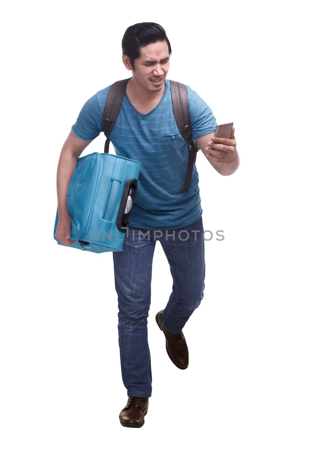 Portrait of hurry asian traveler running with carrying suitcase isolated over white background
