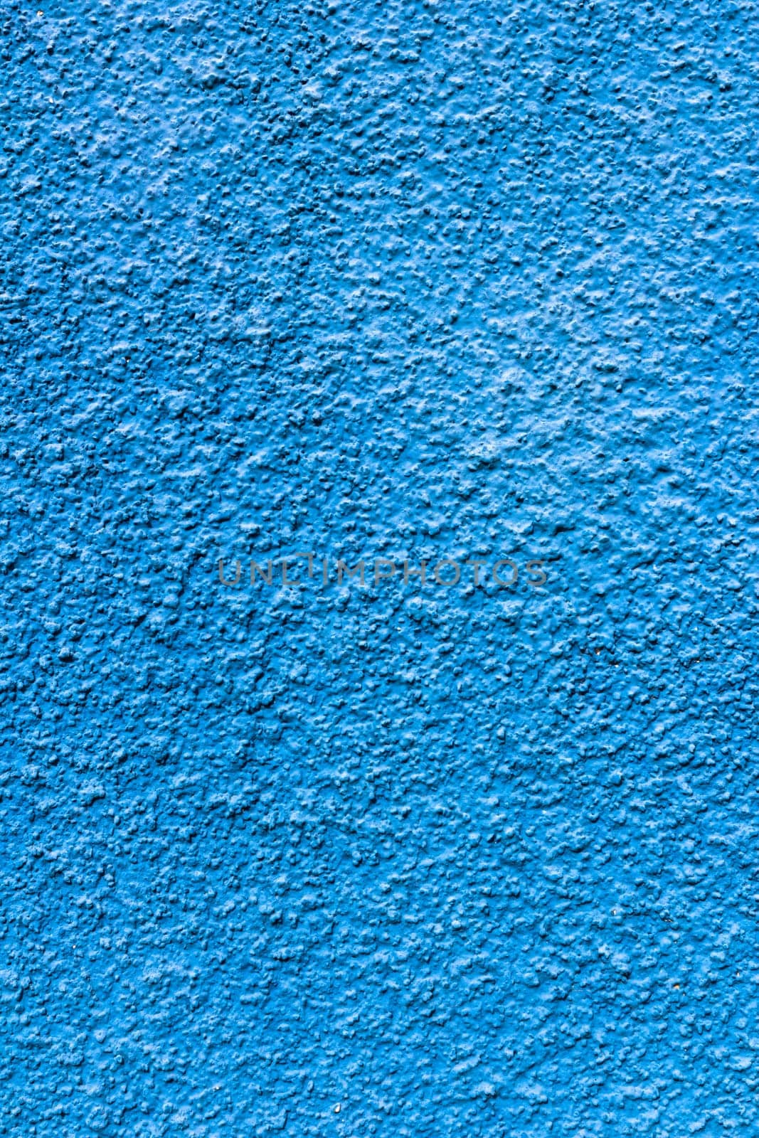 Abstract deep blue wall plastered texture. Rustic background.