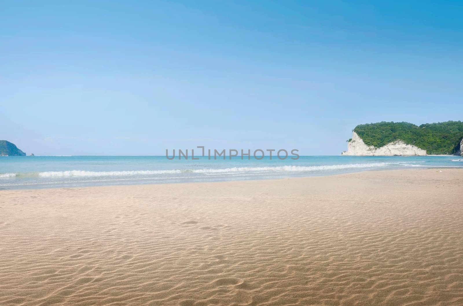 Landscape view of tropical beach with blue sea at sunny day