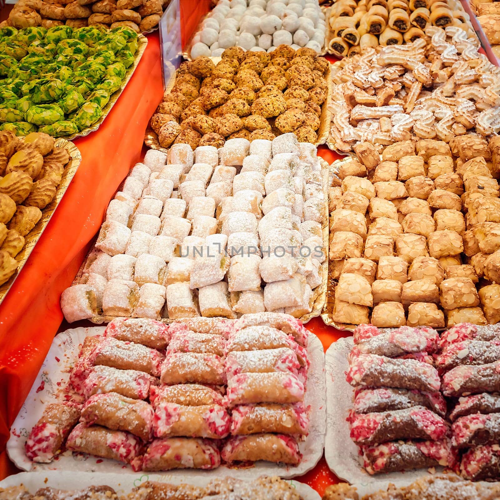 Background of typical sicilian cookies,pastries, made with almond paste for sale in italian market.