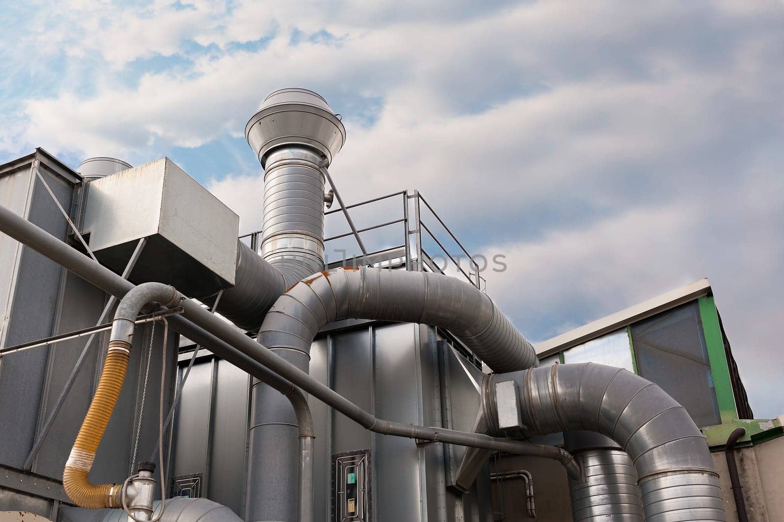 Industrial factory air filtration system. Tubes, tank and chimney.