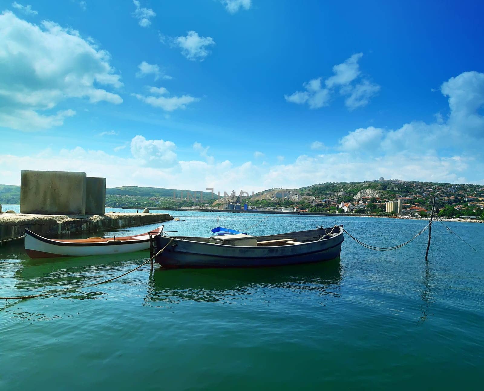 Floating boats in the sea near the pear at Balchik city, Bulgaria. Summer vacation background. Joy, happiness and recreation concept