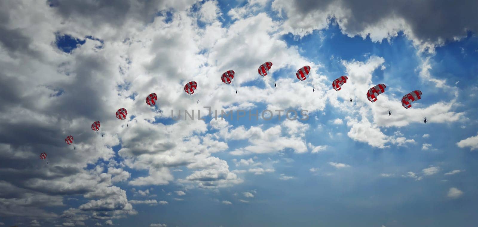 Man paragliding in the sky captured in different phases. Extreme sport.
