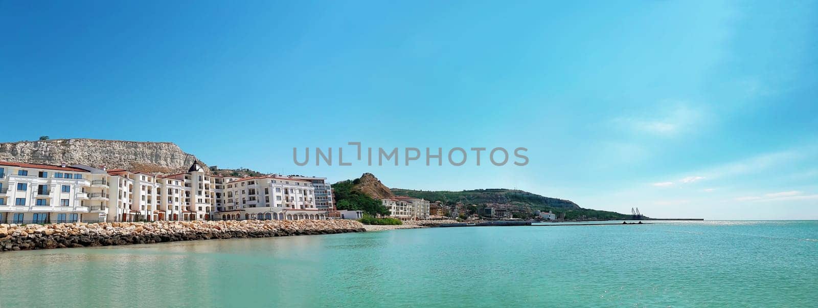 Clear morning scene with a hotel on the seashore. Panoramic view of the coast of Black Sea, Balchik city, Bulgaria