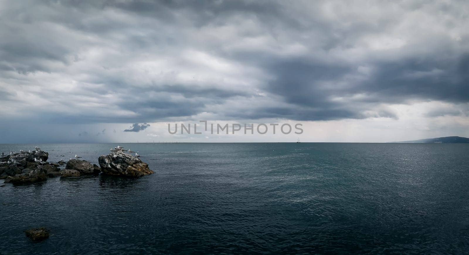 Seascape with a dramatic stormy sky. Beautiful view at the coast of the Black Sea in Balchik city, Bulgaria.