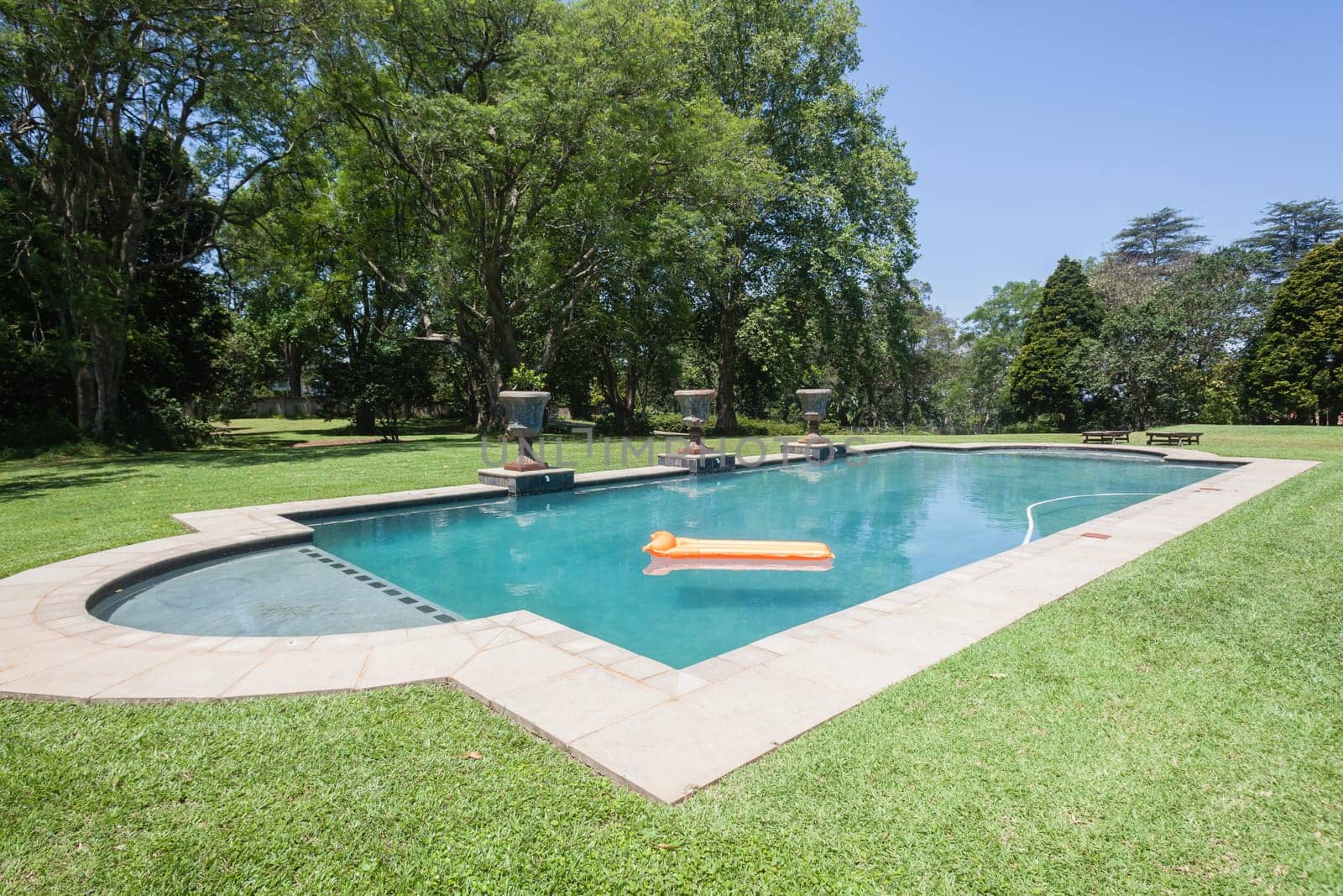 Summer day young girl swimming pool at  private home