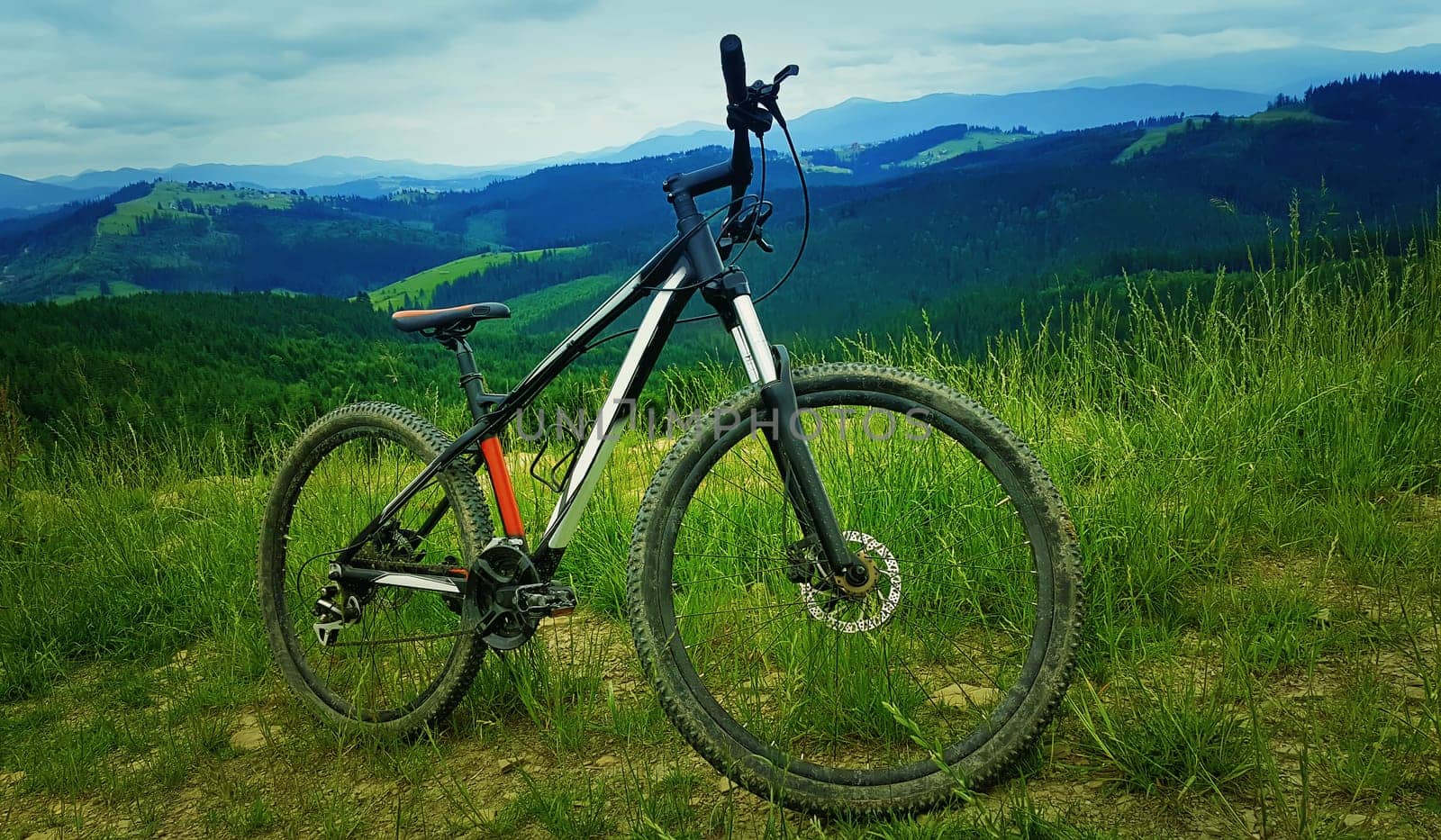 A bicycle over the moutains backround. Biking adventure and traveling symbol. Healthy lifestyle concept