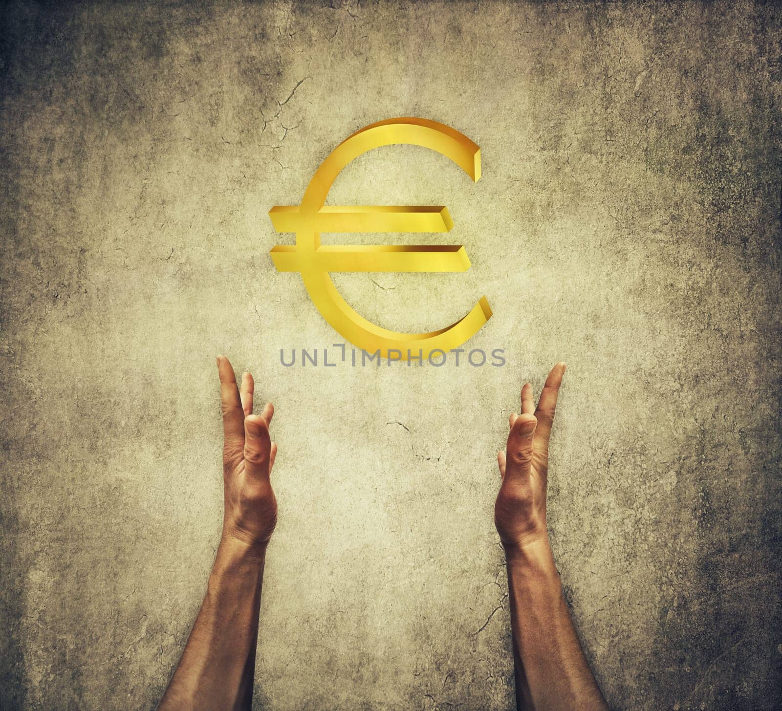 Closeup of two human hands holding a golden euro sign. Financial concept