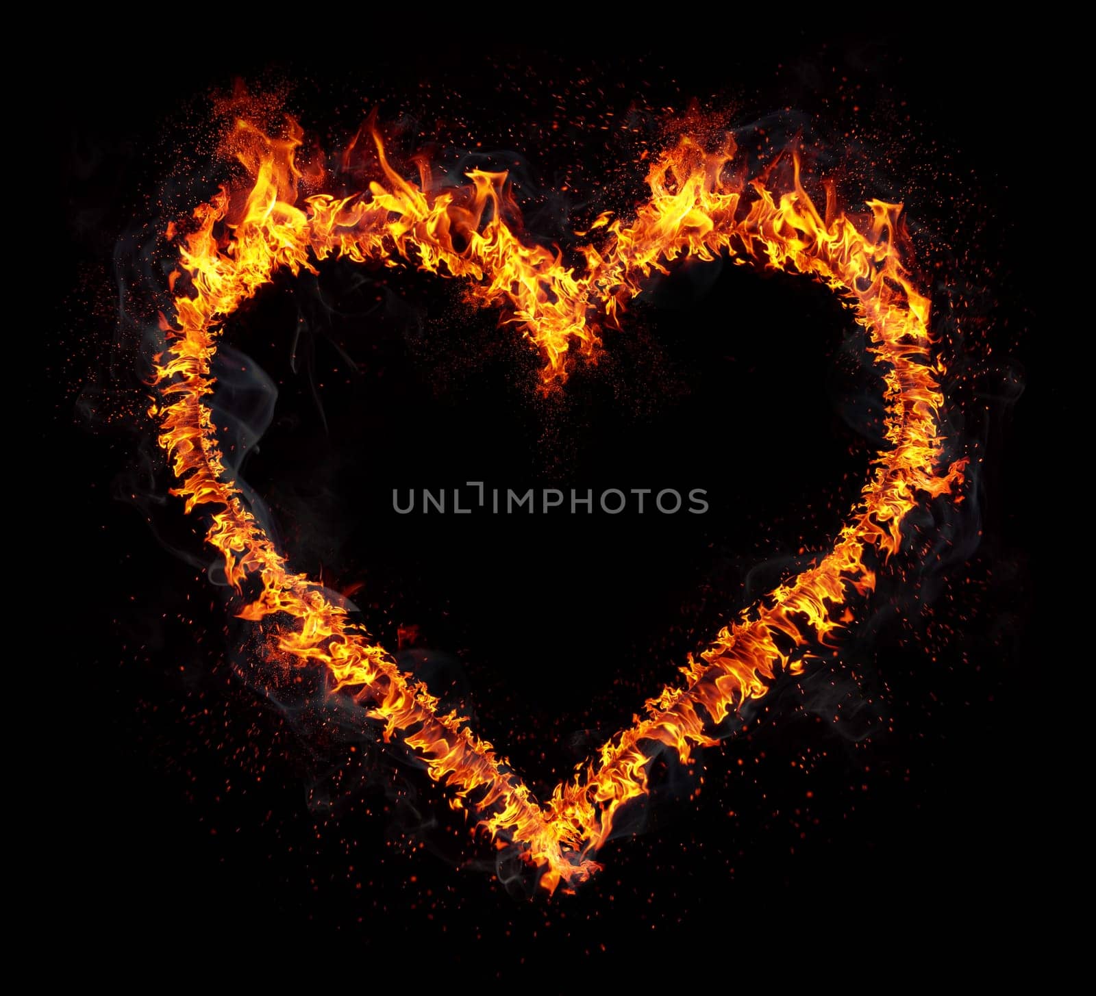 Flaming heart isolated on black background. Love symbol.