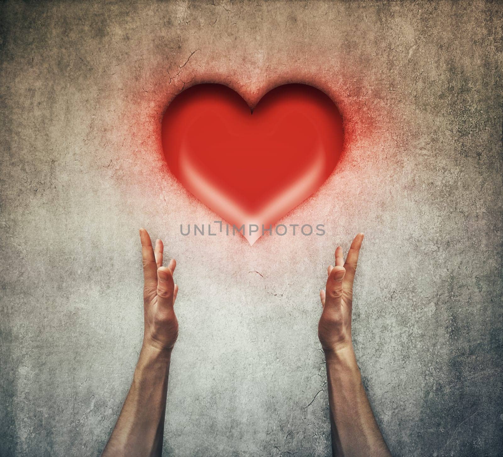 Closeup of two human hands holding a red heart. Healthcare and love concept