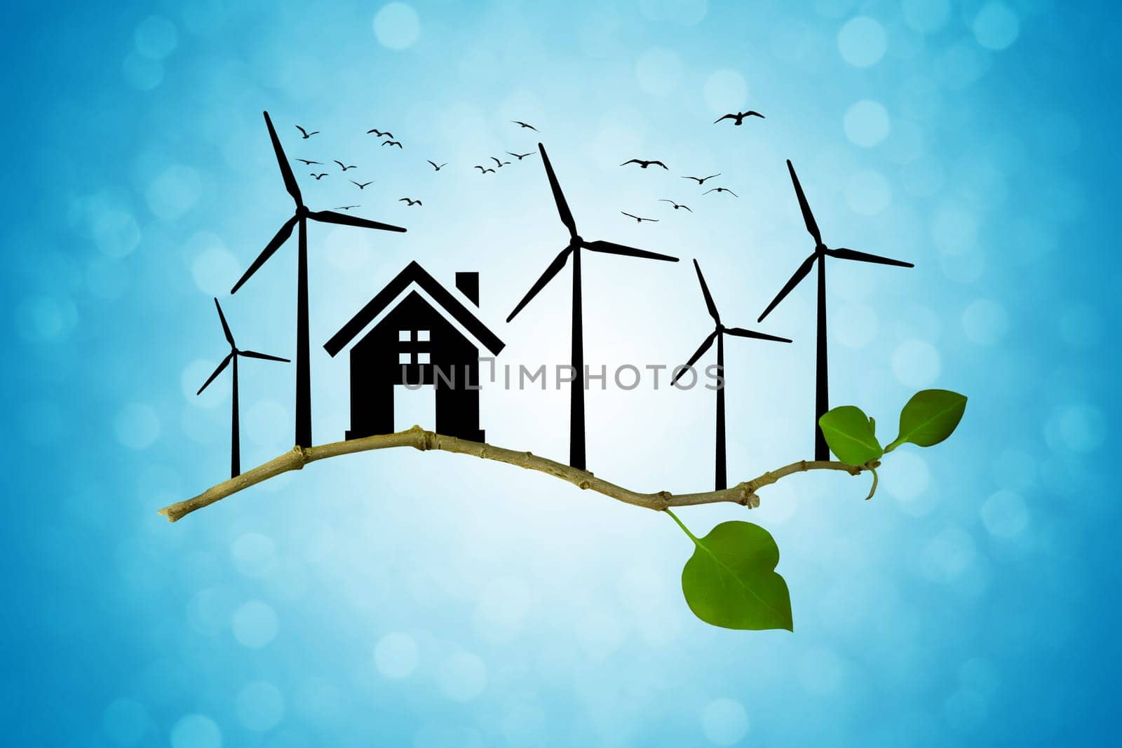 Environmental green energy concept. Silhouette of house, wind turbine and birds flying on a tree branch