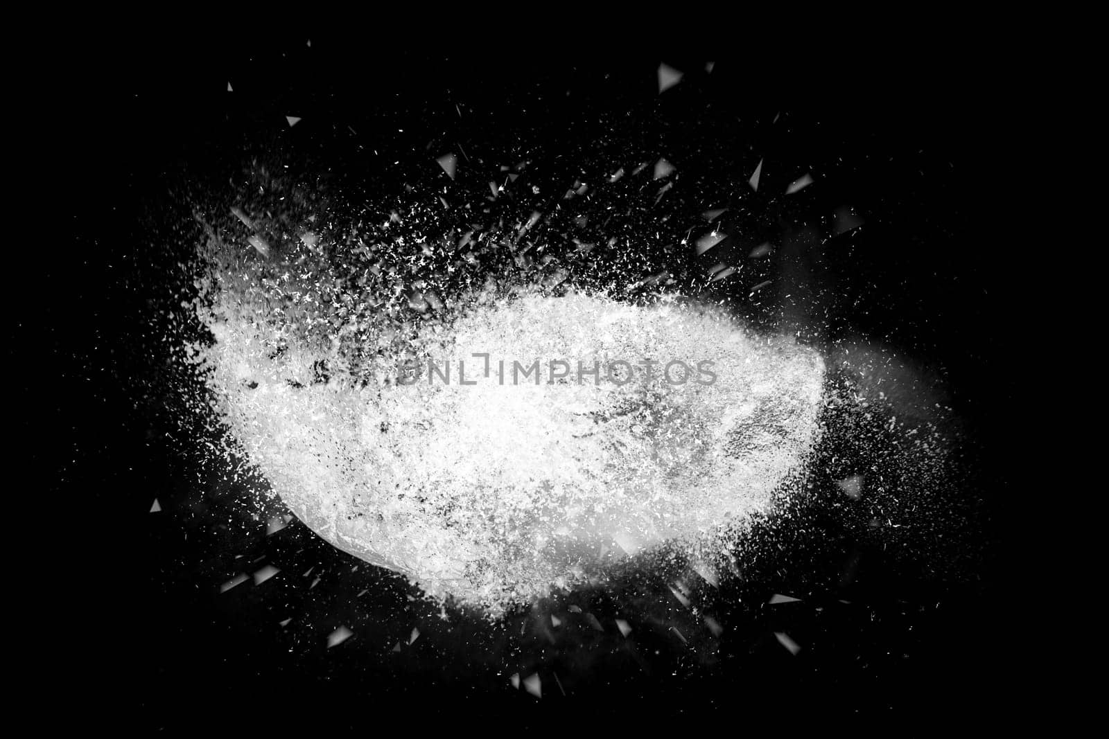Freeze motion of colorful powder paint exploding isolated on black dark background. Abstract design of color dust cloud. Particles explosion screen saver, wallpaper, brush