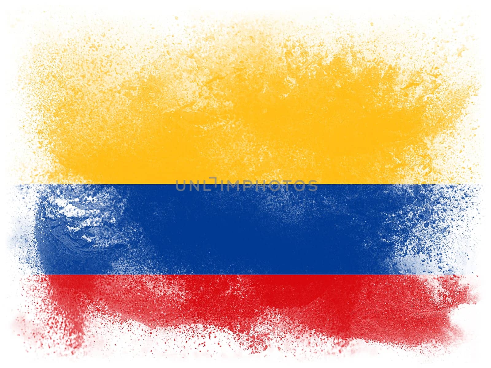 Powder paint exploding in colors of Columbia flag isolated on white background. Abstract particles explosion of colorful dust.
