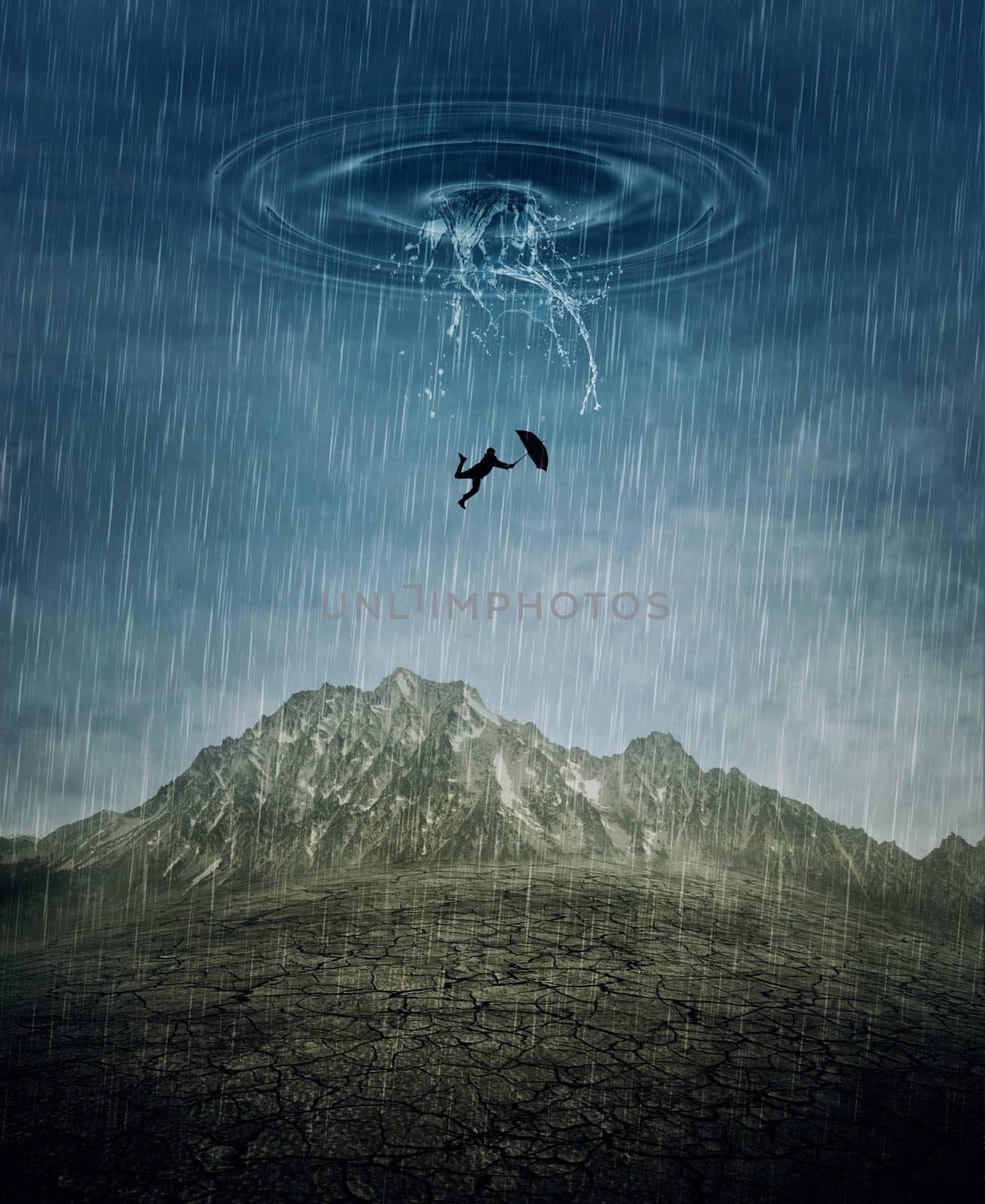 A silhouette of an young man with an umbrella falling from the rainy sky as a splash of water crashing down to the cracked desert ground. Business risk, fail and loss concept